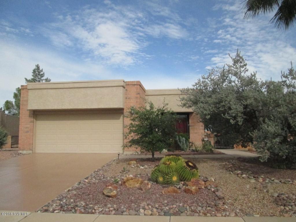 Beautiful free standing home with Great Mountain views from the rear East covered brick Patio. Bright cheerful clean and neat home. Kitchen remodeled with Ellcoy mocha double sink. Quartz counters, pull out shelves, updated lighting with track LED lighting. Painted kitchen cabinets, installed insinkeerator, New GE Electric range smooth top and microwave. New Whirlpool Refrigerator, Black appliances. Metal kitchen pan rack. Ceramic tile floors and Vinyl Laminate plank flooring in the bedrooms. Living room cheerful and bright with extra windows, replaced and put in picture windows and corner windows to take in the Mountain views. Wood Fireplace covered,cover removable. Master Bedroom Walk in Shower. Square feet by owner, incl. office, HANDICAP features, Grab bars, wide doors, level  entry. ceramic tile shower. Delta plumbing in master bath, new tile floor. New fan in bedroom. Instant hot water in baths and a new vanity in the guest bath. New hot water heater. Aquaplex water lines inside and to street. Garage floor and driveway painted. Roof re coated, termite contract, Iron security doors front and sliding patio door. Extra storage extra refrigerator. Bonus room/office. The lot goes beyond the wall. Office is not figured in the county square footage. The square footage is per owner.