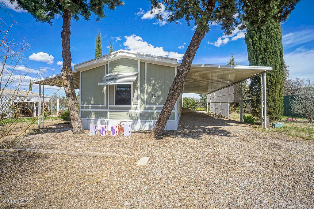 Freshly updated & very well maintained Palm Harbor home on private fenced lot with mature trees and shrubs in desirable Mescal.
Split floor plan 2 bedroom/2 bath with dual master layout (originally a 3 bedroom/2 bath, Buyer can convert back).
Large carport, covered patio and open deck to enjoy the outdoors, plus room to park an RV.  Easy commute to Tucson or Sierra Vista, perfect second home or for primary residence. New flooring throughout, including beautiful laminate wood in the main living areas. New fixtures, countertops, stainless steel appliances and breakfast bar. Shed with workshop, power and overhead lighting. Plus much much more.
