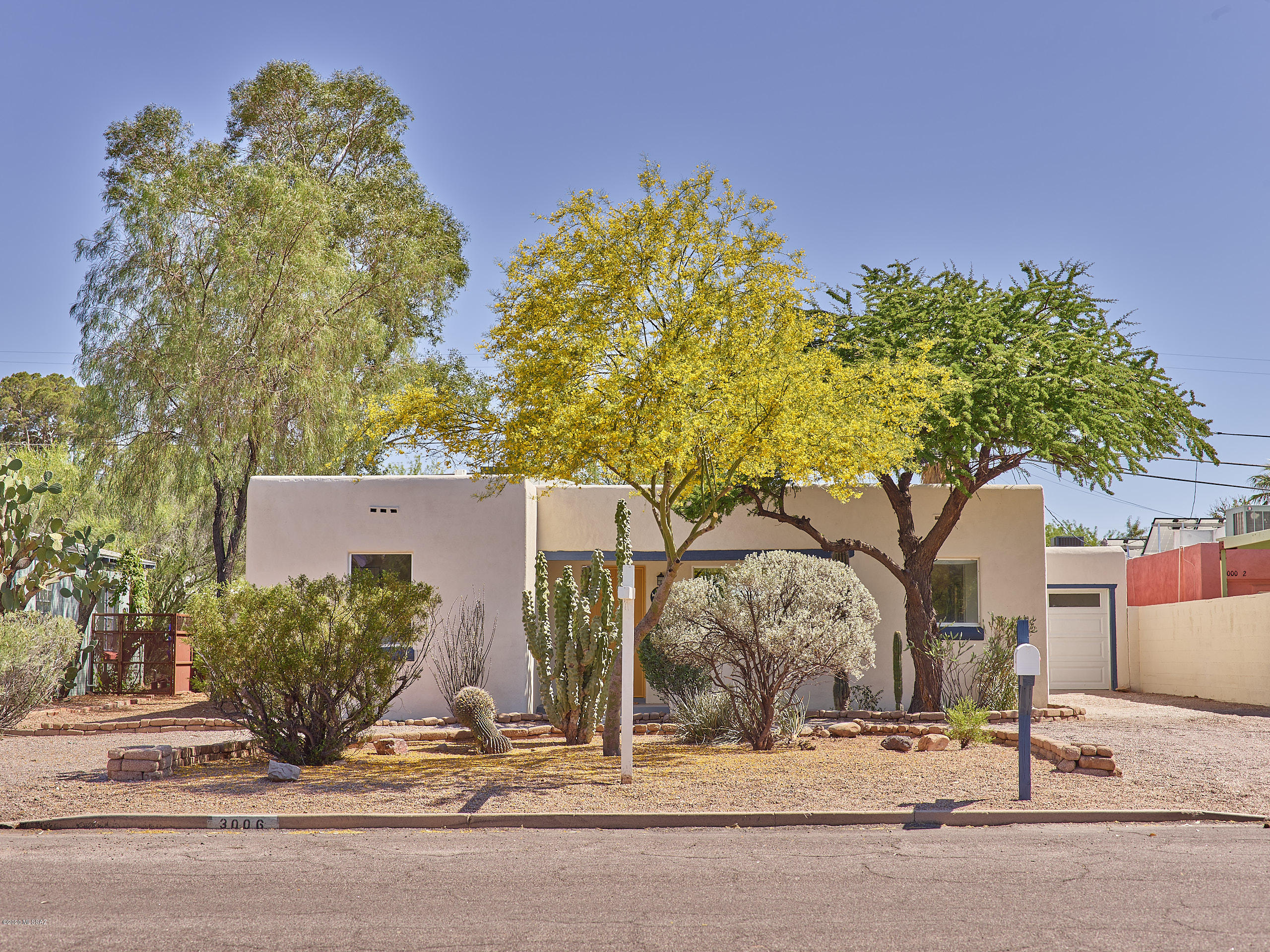 This 3 bed 2 bath plus den, is a tastefully remodeled stunner located in the historic Blenman Elm neighborhood, near the UofA and Downtown. Upon entering you will be greeted by a spacious open living room with warm wood-look tile throughout the home. Get ready to cook in your gourmet kitchen equipped with a gas stove, matching hood, stainless steel appliances, and beautiful white quartz counters. The attached breakfast bar is perfect for entertaining. The Master bedroom's vast size will surely impress along with it's walk-in closet and den that can be used for a home office or home gym. The ensuite bathroom has double sinks, step-in rain shower, and designer tile accents. The large lot is perfect for entertaining, plus plenty of room to build a pool and other amenities. Owner/Agent