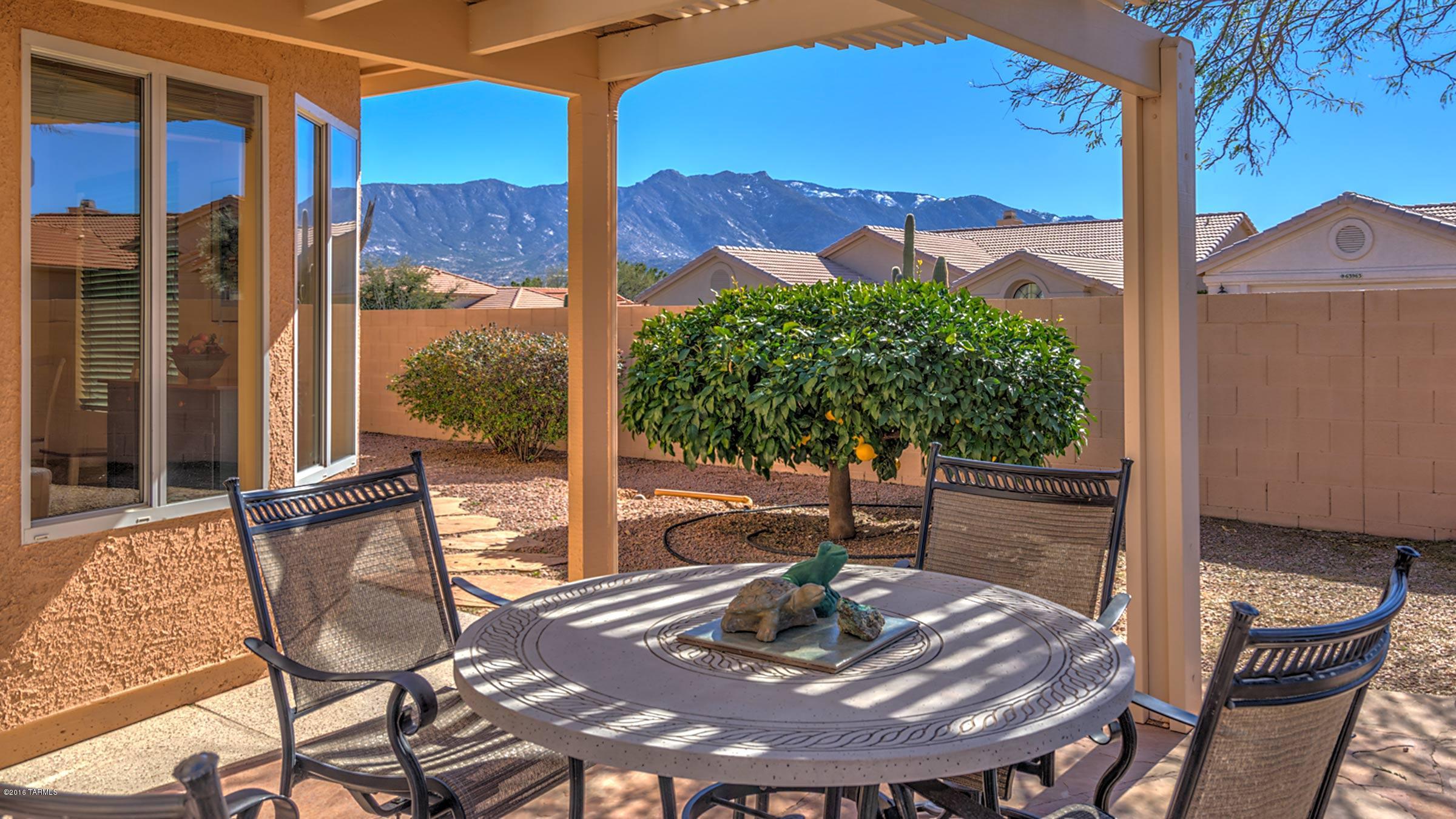This terrific DIEGO is beautifully located near the cul-de-sac at street’s end, with quite lovely views of the mtns both from a front seating area as well as the backyard! This is 2BR/2BA + Den/Office. The Dining area was greatly expanded just off the Kitchen & Great Room. It’s surrounded by 6 windows, creating a light-filled space perfect for day-to-day use and entertaining. The Master Bath has been enlarged to include a large, jetted tub enclosure with glass-block window adding more light. The backyard is so inviting: a rock waterfall feature adds soothing sound to your enjoyment of the fully covered patio + extensive Alumawood ramada, seating wall & citrus trees, too. Solatube in the Guest Bath, plantation shutters, ceiling fans, epoxy coating both front & rear...just some of the ex