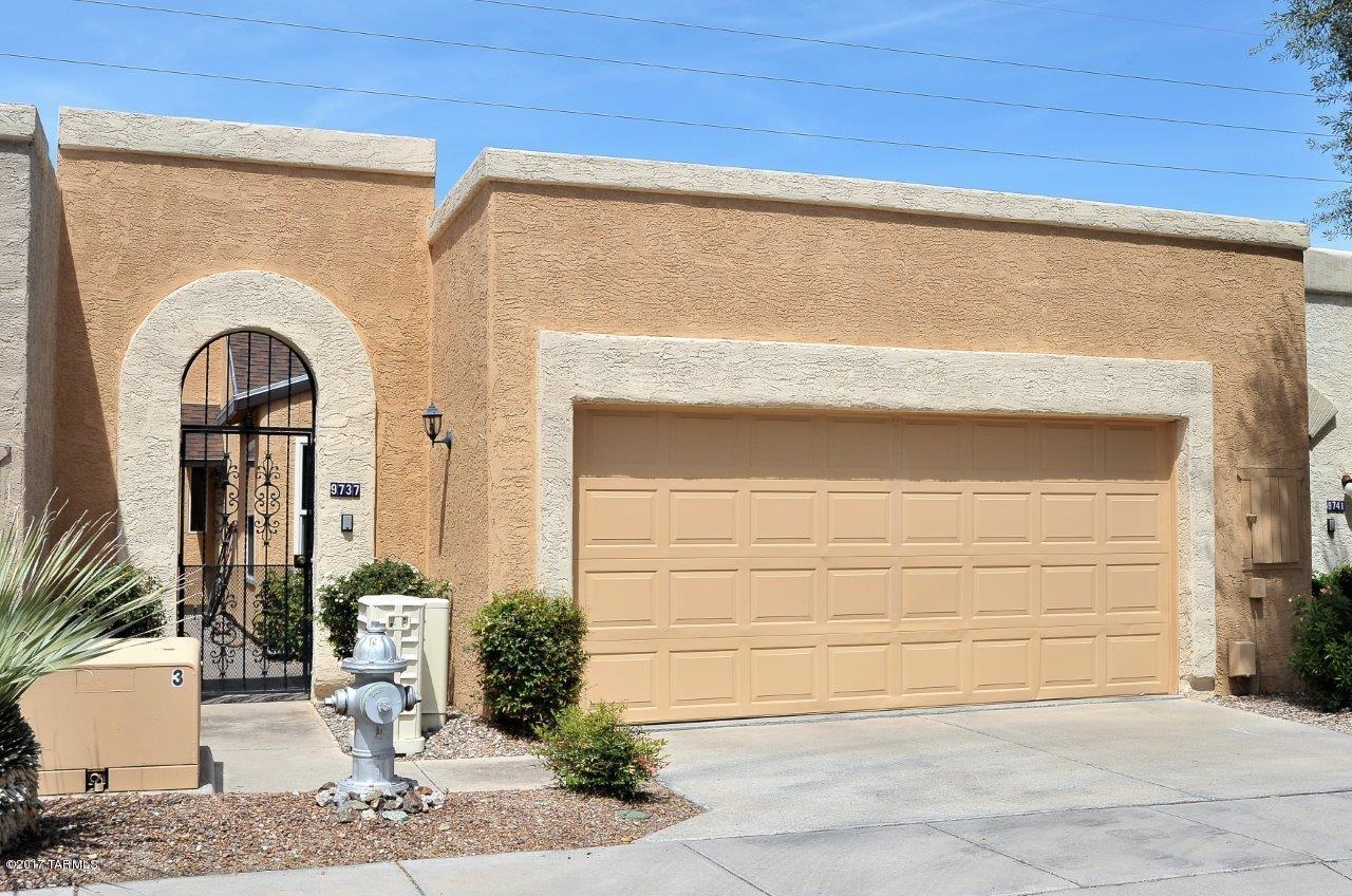 THIS IS IT - SELDOM OFFERED! This well maintained, pristine patio home HAS IT ALL! From the STUNNING MOUNTAIN VIEWS to the tree-lined streets you're going to fall in love all over again! The moment you enter this private and secure gated courtyard entry with intercom and custom gate to the greatroom with the wall of windows viewing to the Catalina mountains plan to be impressed. 2 master suites each with its own bath. Freshly painted interior and exterior, ceramic tile and dual pane Low-E windows throughout, vaulted ceilings, a wood burning fireplace, French doors off the dining area lead to the north-facing nicely landscaped rear yard. The fully enclosed and finished garage has a 20' x 2' storage area. No poly pipes here! And, no maintenance newer aluminum exterior fascia. Great location! Near the bus line, shopping and restaurants.