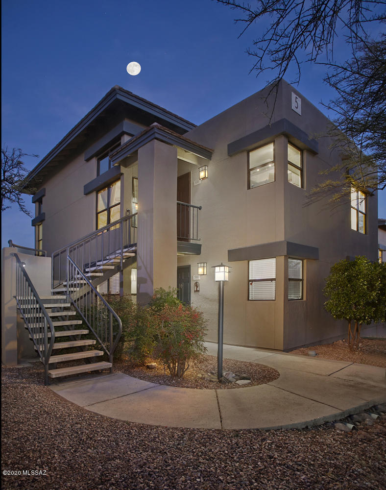 Majestic Mountain Views From This Rare  Corner End Unit In The Greens. Spilt Bedroom Plan, Kitchen with Corian Countertops,Cathedral Ceilings,Tile and Laminate Hardwood Floors.Great Room with Wood Burning Fireplace, Double Pane Windows To Capture The Views And Ceiling Fans. Community has three swimming pools,spa, athletc facility and walking trails. Very close to Ventana Canyon, Sabino Canyon, Grocery Shopping and Restaurants.