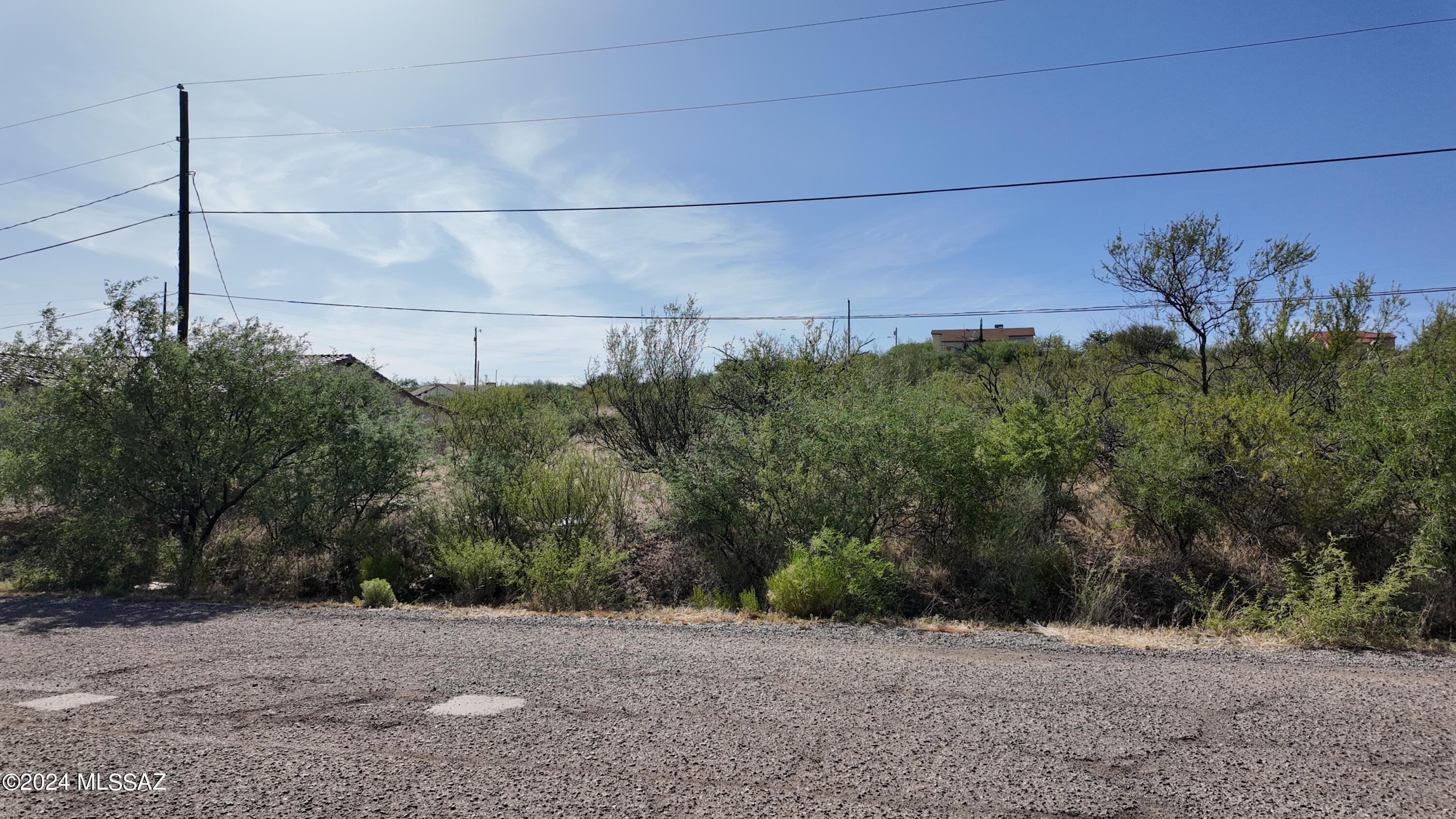 Great residential lot with Electric, water and sewer at the street.  All paved street access.
Flat and easy to build on.