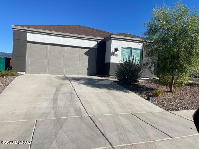 This charming 1 story home will be ready in November. Open concept and nicely appointed with Quartz countertops, raised panel cabinets, stainless appliances, vinyl flooring throughout, 9' ceilings, island and pantry in the kitchen, covered patio, rock in the back yard, front yard low maintenance landscape and so much more. What makes these homes truly special? They were meticulously finished in 2022 and exclusively rentals for a brief one-year stint. Now they're available for you to call home today, making Roadrunner Estates Tucson's most centrally located and irresistible community.