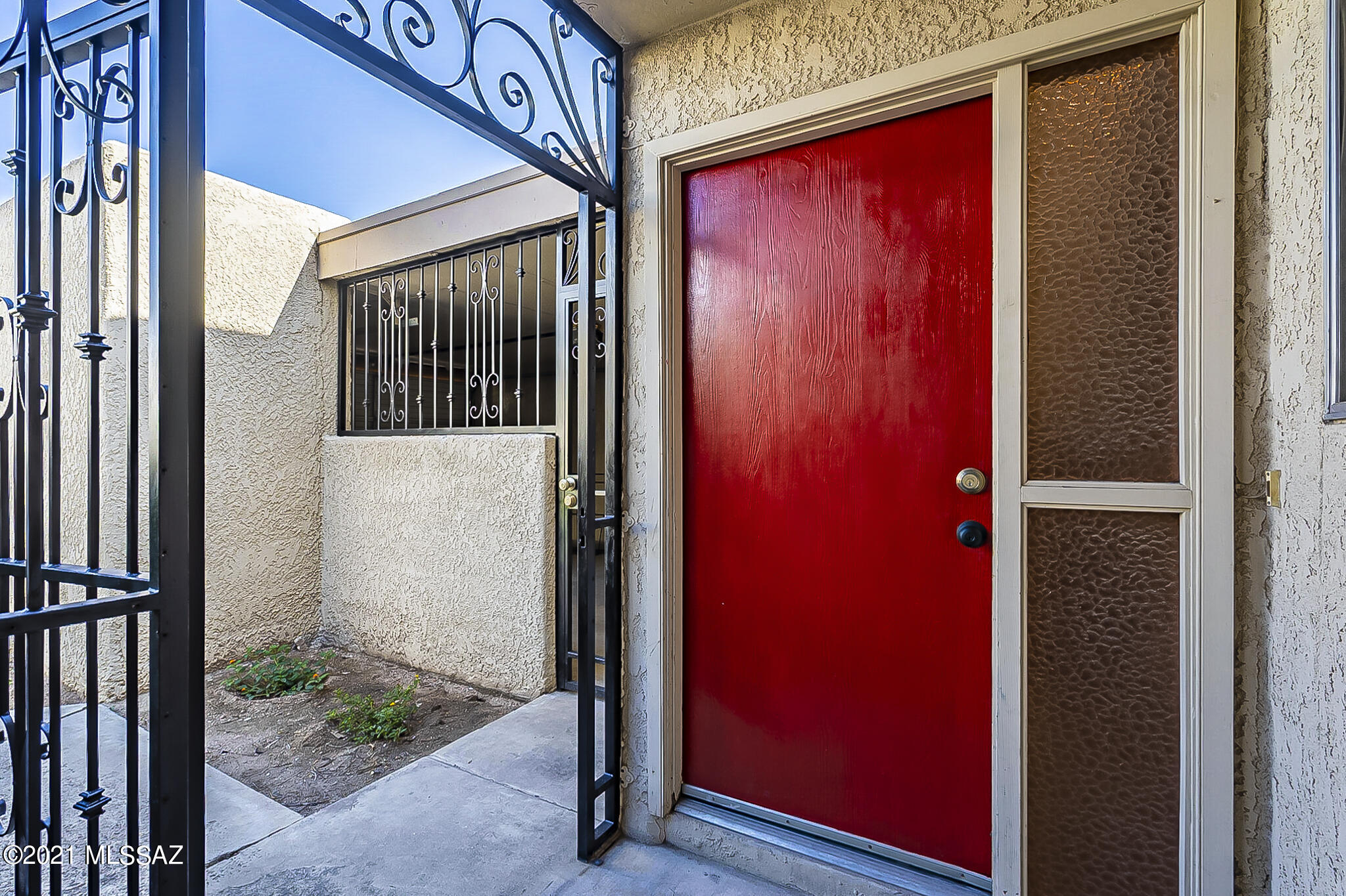 Great townhome walking distance to Rillito River Walk, Tucson Racquet, Fitness Center, & Brandi Fenton Park.  Convenient to all! This home is perfect for a student, first time homebuyer or someone looking to downsize.  The main living area has vaulted ceilings & a fireplace that stretches floor to ceiling! 1 bedroom & 1 full bathroom downstairs. 2nd bedroom is Loft style upstairs with full bathroom/walk-in shower.  New beautiful tile installed downstairs. New shower insert installed upstairs. Both bathrooms have new toilets. Freshly painted interior. New kitchen sink, garbage disposal & faucet. Generous sized  fenced yard backs to common areas that are meticulously maintained.  Community pool, parking and lots of shade trees all around. This home is ready for you to move on in and enjoy!
