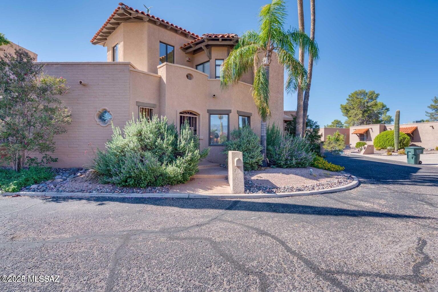 Range priced between $450,000-$475,000. Be captivated by this 3 bedroom, 2 full bath with additional guest bathroom,, two-car garage estate townhome unlike any other, in Dorado Country Club Estates. Travertine flooring throughout lower level from chandeliered entry foyer to the great room with a stunning two-story fireplace and wetbar. French doors lead to a secluded brick patio with a mautre grapefruit tree, adjoining an Arizona room that can be opened to the outdoors. It can be converted to a fourth bedroom or den if desired. Formal dining room is complete with a built-in buffet. The modern kitchen is a chef's dream, featuring granite countertops, ample top-of-the-line cabinetry, center island, a stainless steel Sub-Zero refrigerator, matching appliances and a breakfast nook.