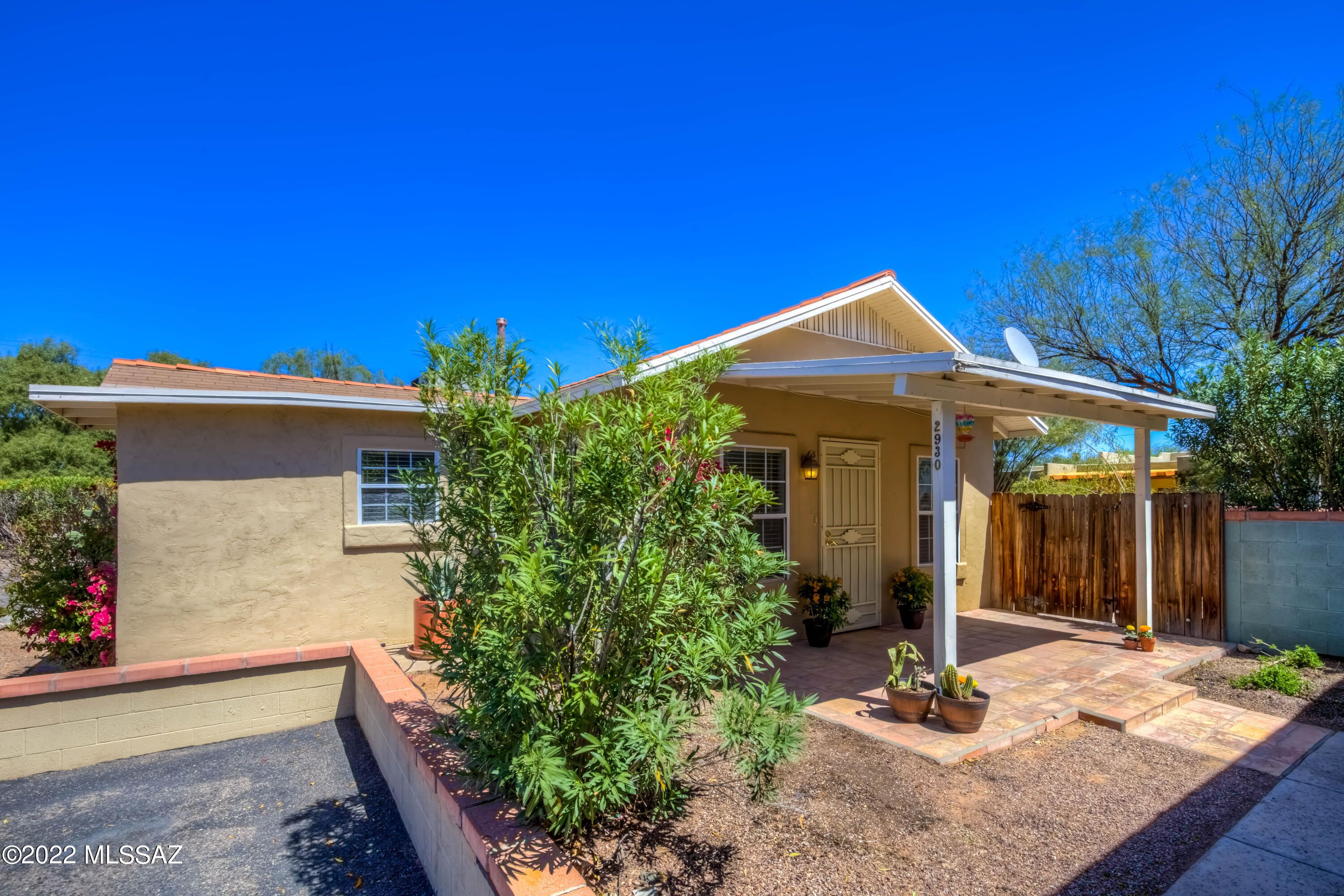 Welcome to this delightful bungalow in the heart of Tucson!  Located in the quaint, 7-home community of Adelaide Farms, this home features 952 sq.ft., 2 bedrooms, 1 bathroom, bright and open Living Room, inviting kitchen and a  large laundry room!   With the refrigerator, washer, dryer, window coverings and ceramic tile throughout, this home is truly MOVE-IN READY!  Enjoy the serenity of the front covered patio and the SPACIOUS rear yard that is ready for your personal touch! HOA covers road and front yard maintenance!  Just moments away from the University of Arizona/Cat Tran route, Mountain Ave. bike route, Banner Medical facilities, and the popular Campbell Corridor with shopping, dining and entertainment, the location is unbeatable! See our 3D walk through and schedule your tour today!