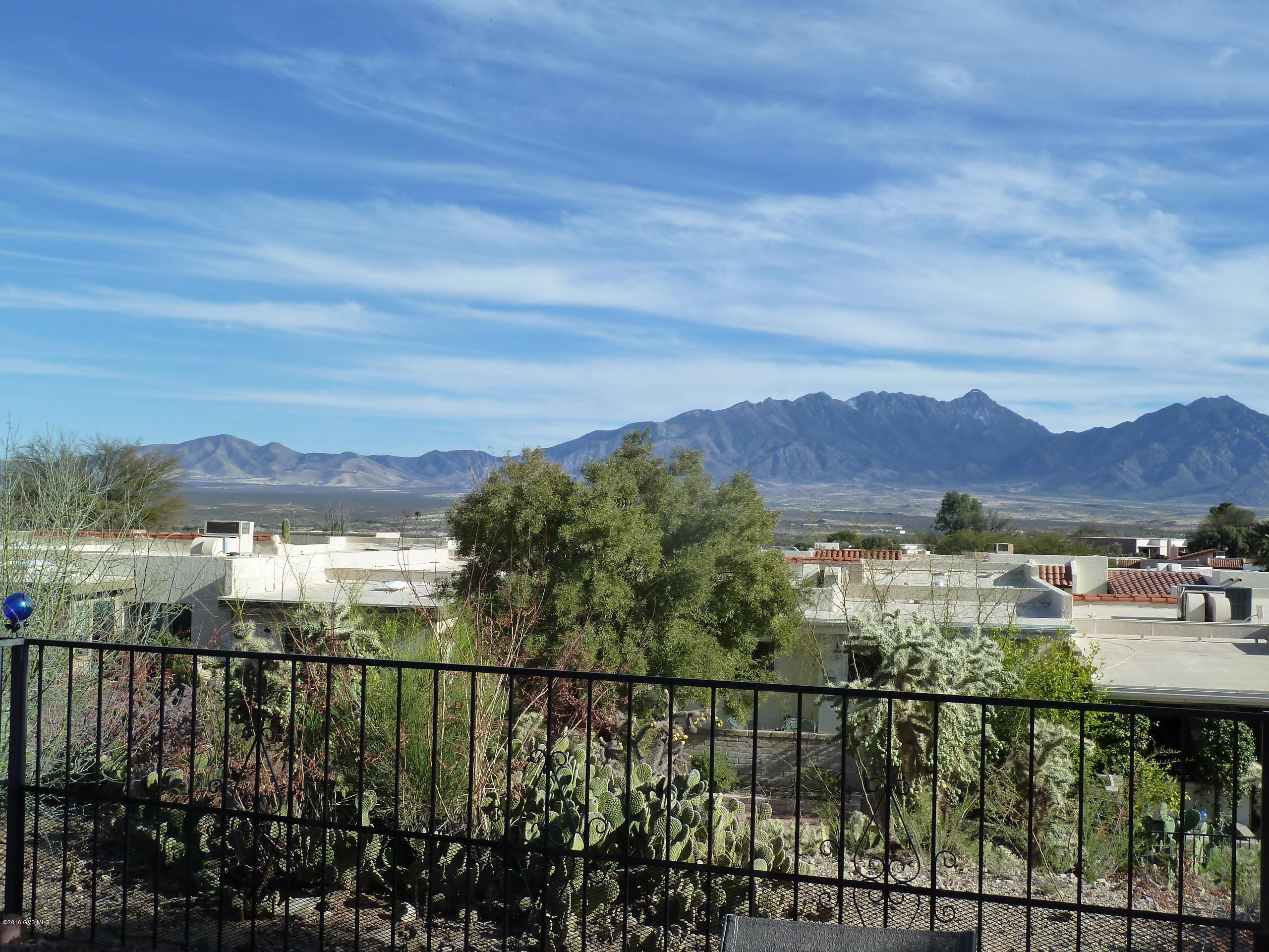 Beautifully updated townhome with gorgeous panoramic mountain view. Just move in and start enjoying all this townhome has to offer. All tile except two bedrooms. Iron enclosure garage can be left open, or totally closed with single door access. Great for seasonal owners. Don't miss the Visual Tour!