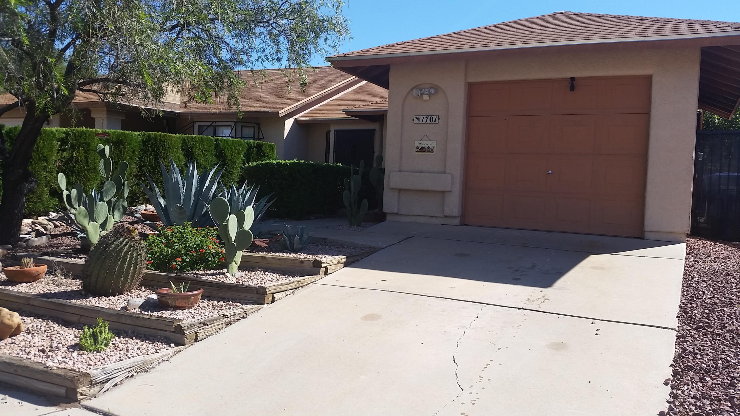Move-in ready. New back cedar fence and landscaping(front & back) flagstone & gravel, microwave, electric stove and garbage disposal, all interior painted in 2013, tile and pergo floors, new bathroom and kitchen sinks & new  A/C in 2014. Better than the rest. Split bedroom plan with living room & dining room. High breakfast bar in kitchen & dining room area. Guest bath made into a handicapped accessible shower with wide door & wide hallway. Garage turned into bonus room/storage and an office. Covered patio in the back. raised flower bed, community pool within walking distance. Midvale Townhouse; home is connected to the home next to it.  Security and solar lights. No carpet.