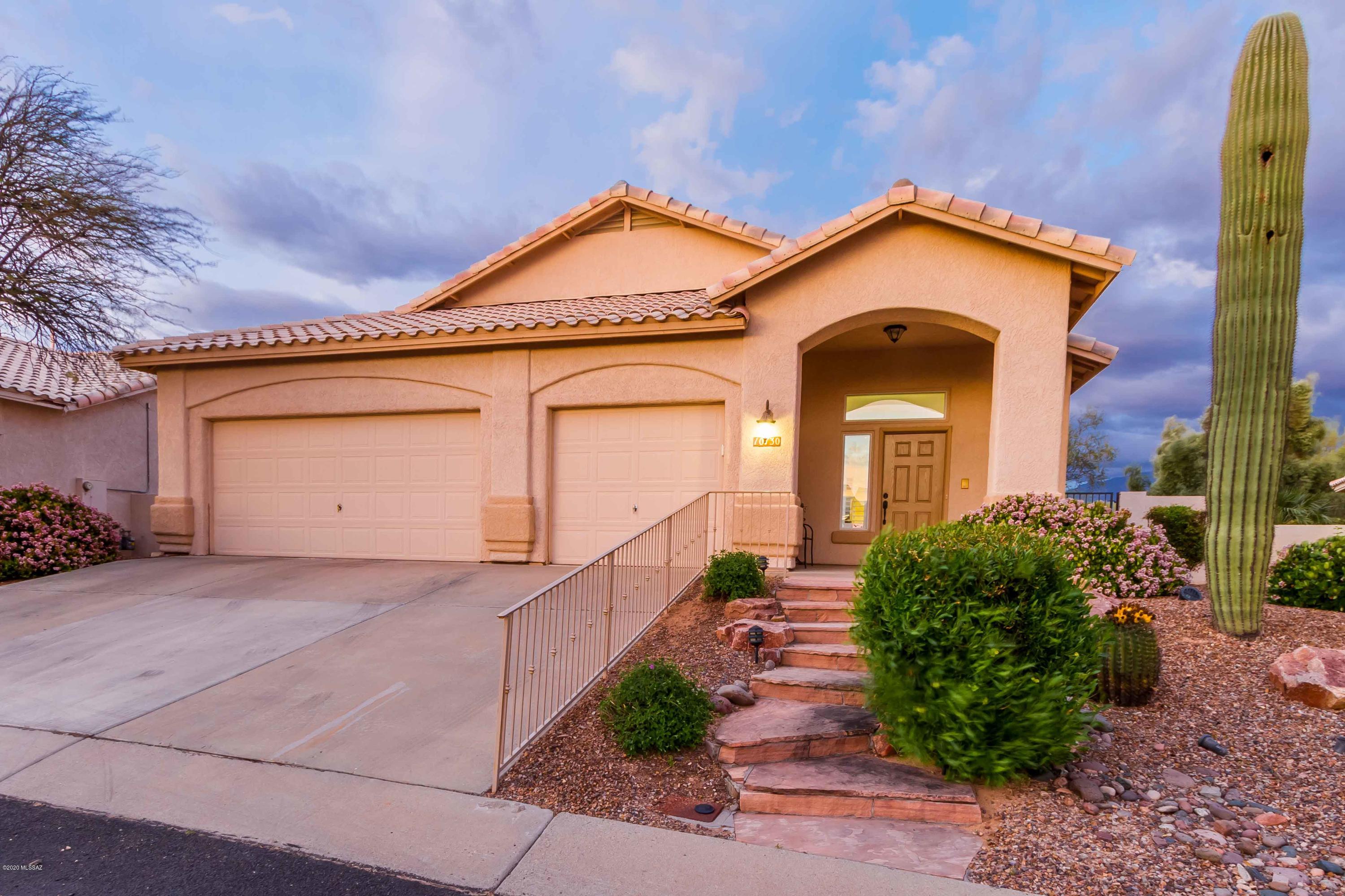 Beautifully move in ready w/ gorgeous golf course views & majestic views of the Catalina Mountains. Tasteful 3 bedroom w/ updated kitchen, baths & 3 car garage is ready for it's next owner!  Highly sought after Canada Hills SINGLE STORY home near great schools, restaurants , shopping, the Oro Valley Community Center, and some of the best hiking and biking trails in town!  Professionally landscaped & east facing backyard is the perfect spot to entertain & enjoy the action of the 15th tee/fairway! Custom paver work, faux grass & expansive cov patio! Inside, enjoy turn key features like granite counters, knotty alder wood cabinets w/ pull outs, newer appliances & neutral tile flooring in common areas, upgraded lighting,  updated bathrooms, en suite w/ ext shower w/ custom tile design & more! NO POLY PIPES!
