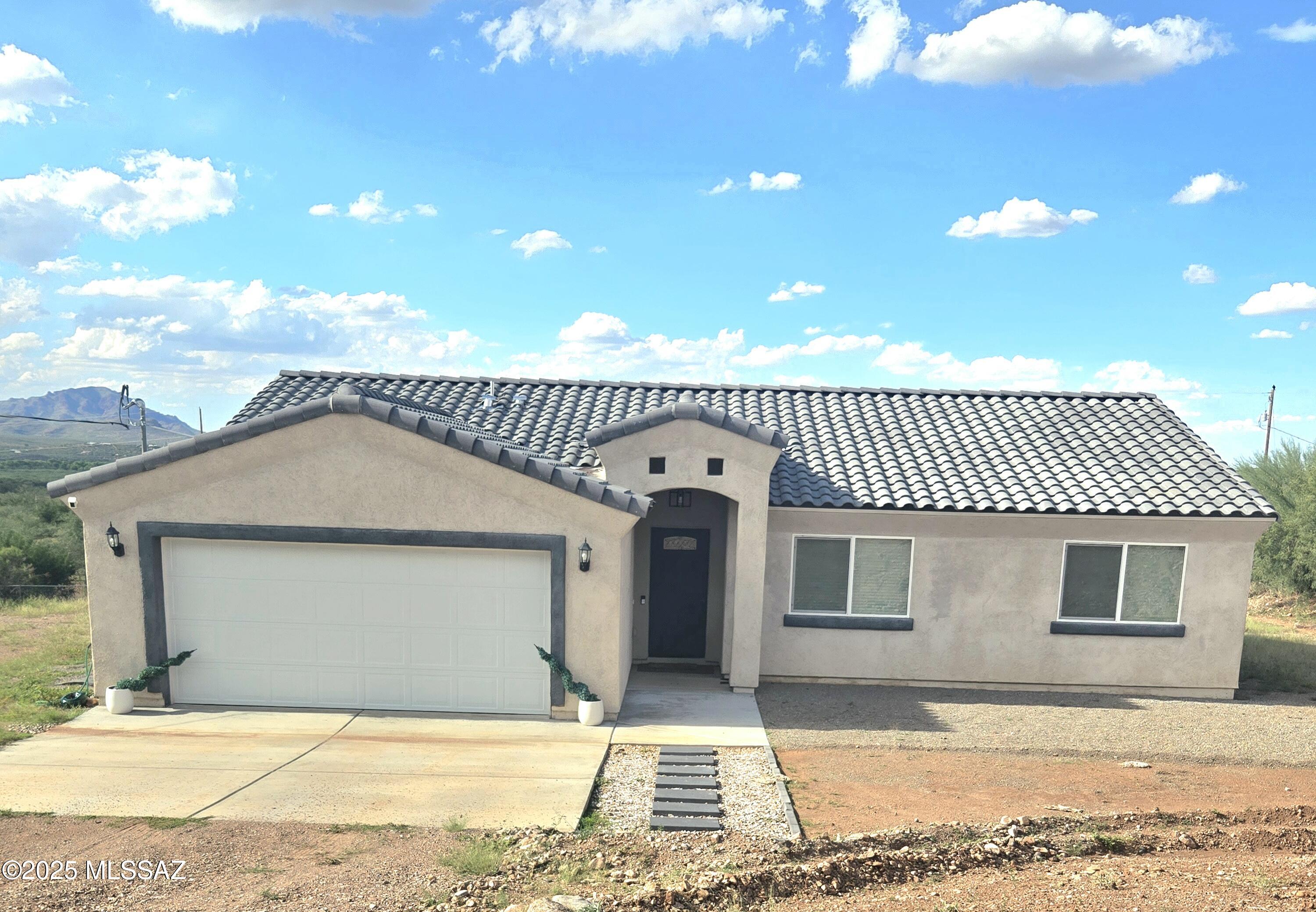Rent this beauty before it's gone. 3 bedroom 2 bath home surrounded by beautiful mountain views. Woodlock floors throughout the entire home. Offering a beautiful granite counter top kitchen and stainless steel appliances. This home provides .48 of an acre of space. Attached 2 car garage space available. Apply now!