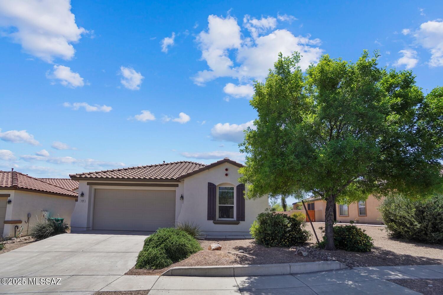Limited-Time Offer! Sign a lease and enjoy your first full month's rent FREE. Don't miss out on this great savings opportunity! Welcome home to this light-filled, pet-friendly 4-bedroom, 2-bath rental in beautiful Rancho Sahuarita! Featuring 1,861 sq ft of space, this single-story gem boasts a modern open-concept layout, gas cooktop, double wall ovens, microwave, refrigerator, and a spacious kitchen that flows effortlessly into the sun-soaked living area. Enjoy fresh air under the covered patio, host gatherings, or unwind in your peaceful backyard. With a 2-car garage and thoughtful updates throughout, this home is perfect for those who value comfort, style, and function. Cats and small dogs welcome! This property uses a self-showing system; register on our website to schedule a viewing.