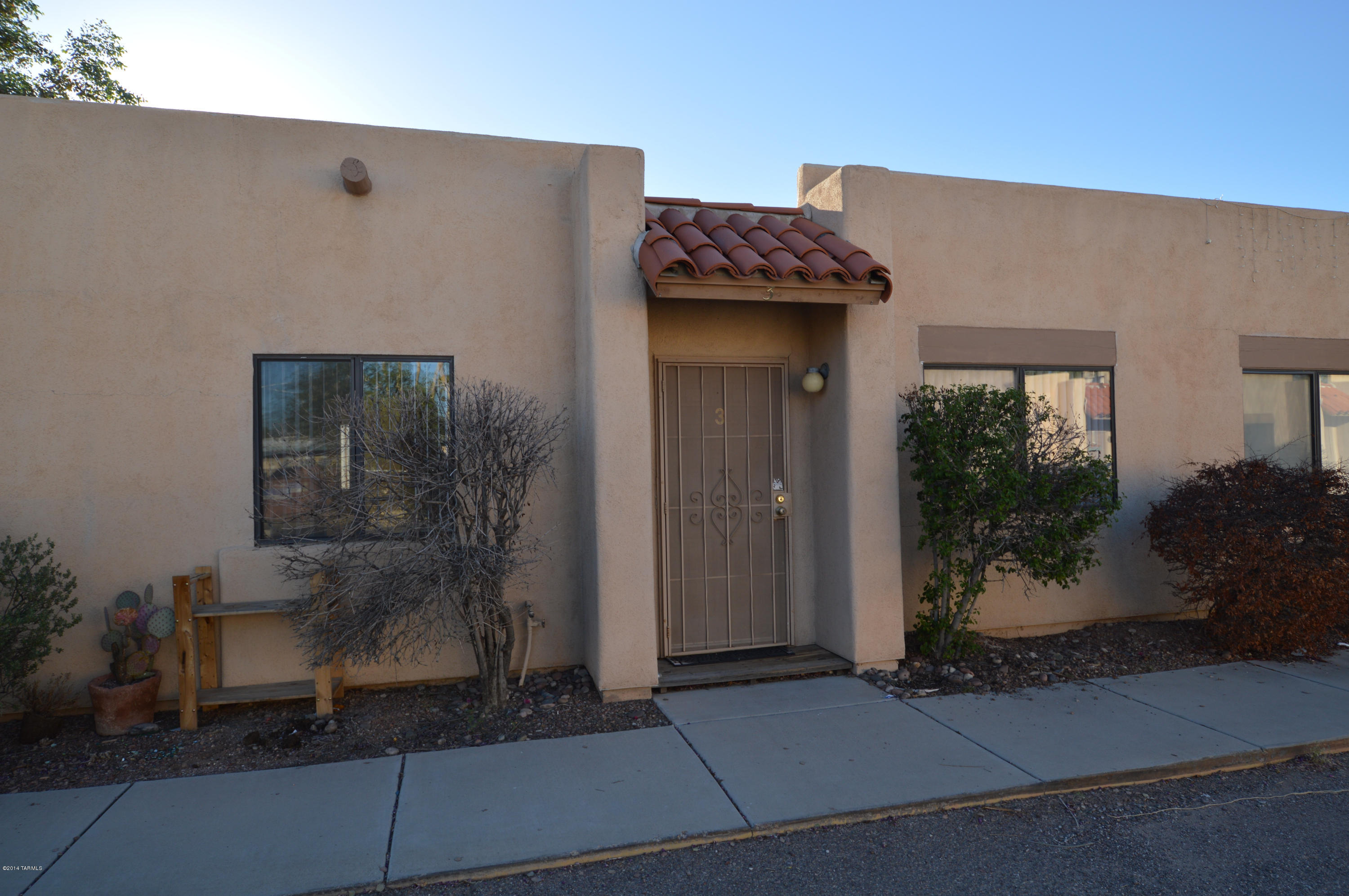 Stunning Santa Fe Townhome in quiet, well maintained complex! Energy efficient windows and AC. Cozy fireplace in spacious living room. Two large bedrooms each with a bath! Detached carport with additional storage! Big covered patio opens to fenced yard perfect for kids and approved pet!! Huge laundry room with washer and dryer for your convenience! Brand new carpet and tile! This unit is gorgeous and waiting for you!! CALL TODAY!!
