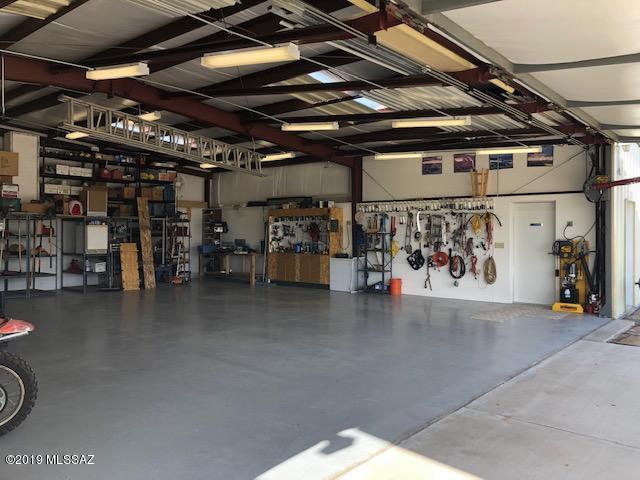 HIGH CLASS AIRPLANE HANGAR COMPLETE WITH 400 SQ. FT. OFFICE AREA.  HANGAR IS WELL EQUIPPED AND INSULATED, DRYWALL ON THE WALLS UP TO 7.5 FEET.  MEASURES 40'X 45'.  SELLER IS INCLUDING A GENERATOR AND THE FURNISHINGS IN THE OFFICE EXCEPT THE ROLL TOP DESK AND ROCKING CHAIR.   THIS AREA IS CALLED FLYING DIAMOND AIRPARK, THERE ARE SEVERAL RESIDENCES WITH HANGARS AND SOME LOTS ARE OWNED BY HORSE ENTHUSIASTS.  THERE IS A COMMUNITY PAVED RUNWAY.  THIS OFFICE AREA IS NOT ALLOWABLE BY THE CC&R'S FOR LIVING QUARTERS BECAUSE IT WAS NOT PERMITTED AS SUCH WHEN BUILT.  THE PARCEL IS READY TO BUILD AT LEAST THE MINIMUM REQUIRED 1500 SQ. FT HOME.  THE IMPACT FEES HAVE BEEN PAID AND THE SEPTIC HAS BEEN INSTALLED.