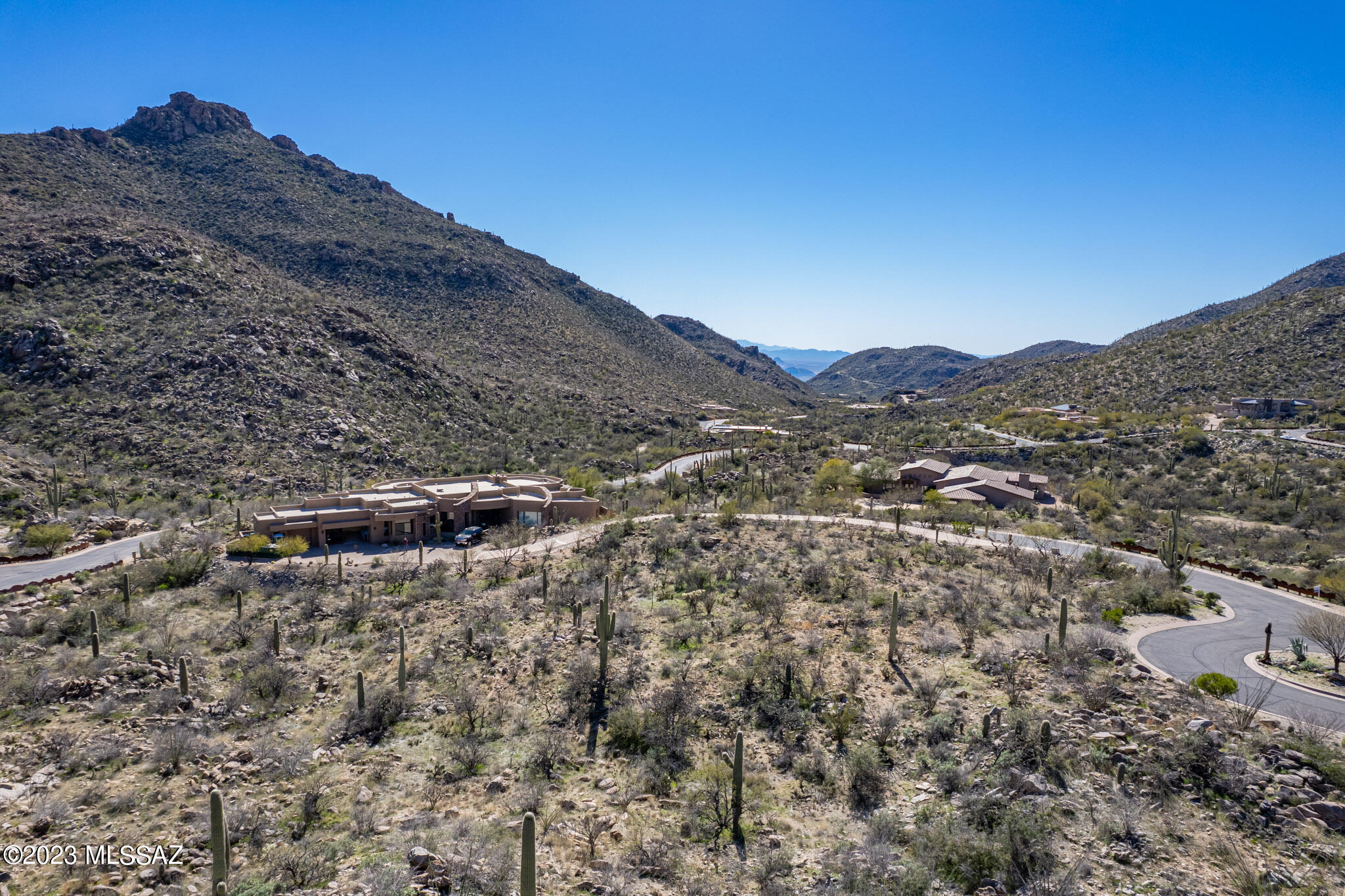 Spectacular Dove Mountain- manned gate at Canyon Pass ! An easy build and a VIEW down the canyon make this lot very special. This custom homesite is located on a cul-de-sac with stunning upper canyon views and distant valley views. Dove Mountain is home to the Ritz Carlton Resort and Spa. Gallery Golf course , club 63-ICON, is nearby along with state of the art Sports center. Hiking and biking at it's finest. Call for private showing!