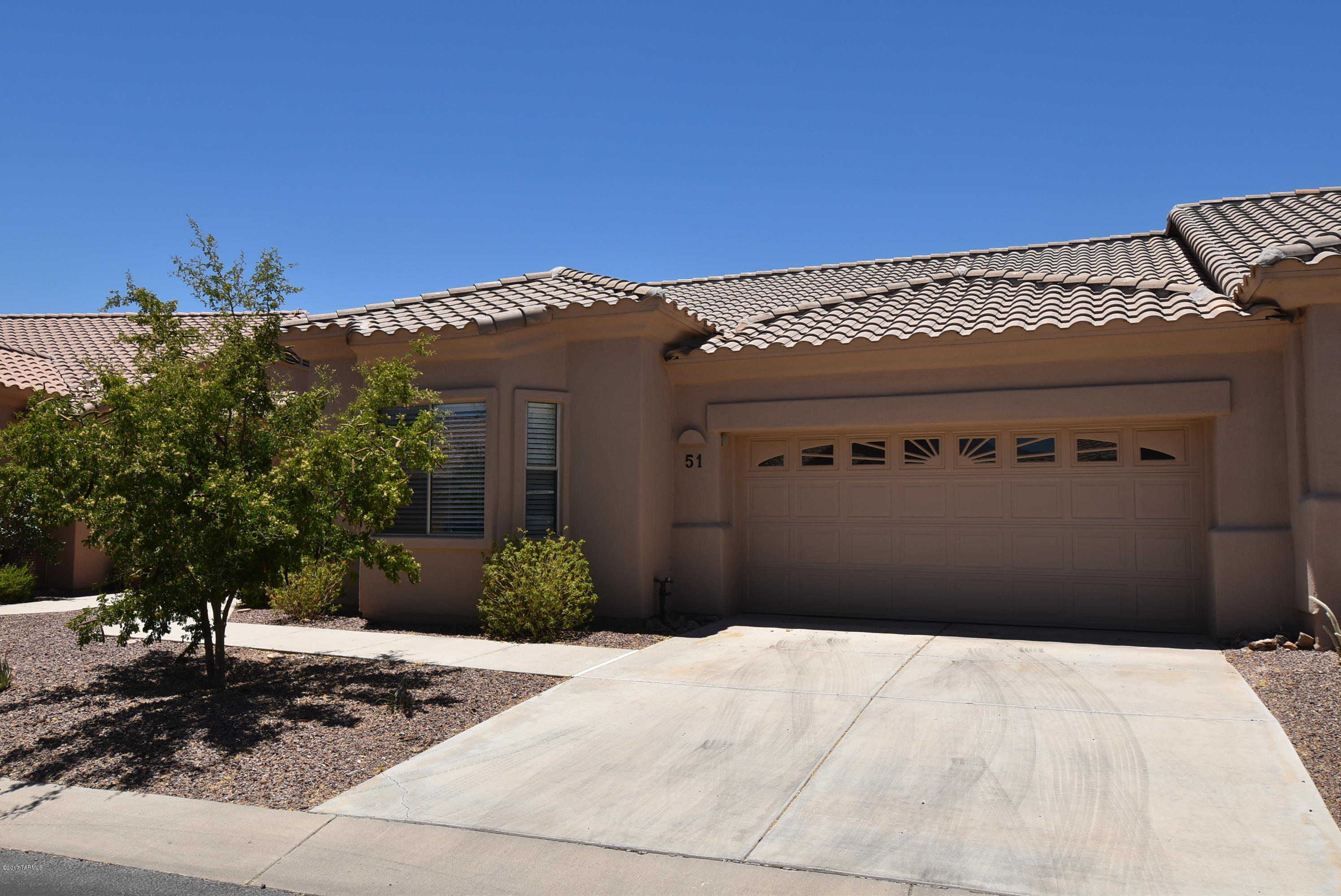 Looking for an unfurnished rental in a beautiful retirement community with amenities? Here it is! Beautiful retirement community of Vistoso Village in Oro Valley. Enjoy care free living in Rancho Vistoso with lots of amenties included. Vistoso Village has a club house with 2 pools, spa, gym, and library. Rent includes  water,garbage,sewer,basic cable TV,outside pest control & landscaping. This 3BR/2BR+den,2BA features a double master bedroom set up,a cozy fireplace in the great rm, spacious kitchen with maple cabinets & breakfast bar,covered patio with privacy behind,and 2 car garage. Washer,dryer,refrigerator included. 3rd bedroom is a den with no closet. Non-smoking home. This is a retirement community. Age restrictions apply (minimum age 40 & no one under 18)...call agent for details.