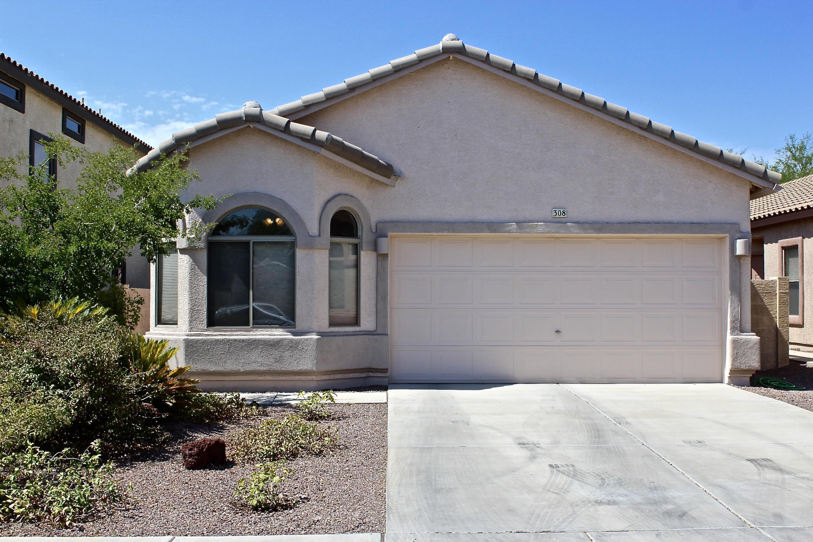 Your home search is over! This is ''THE ONE''! Beautifully updated home with so many important features. Not to mention, all the wonderful amenities that comes with living in Rancho Sahuarita! You'll be delighted as you first step into find new hard wood flooring! Pair that up with the upgraded 40'' cabinets with crown molding to give you a stunning kitchen to gather around. Open floor plan with 4 bedrooms! The insulation is upgraded to R38 to help with utility costs also the attic has a special radiant barrier R30. Delight in C-fans for every room, the garage has an extra side door, Newly painted exterior & added gutters. There is long side yard, perfect for your furry family! The landscaping is nicely completed with pavers, a pergola, & solar lighting. Absolutely Exquisite!
