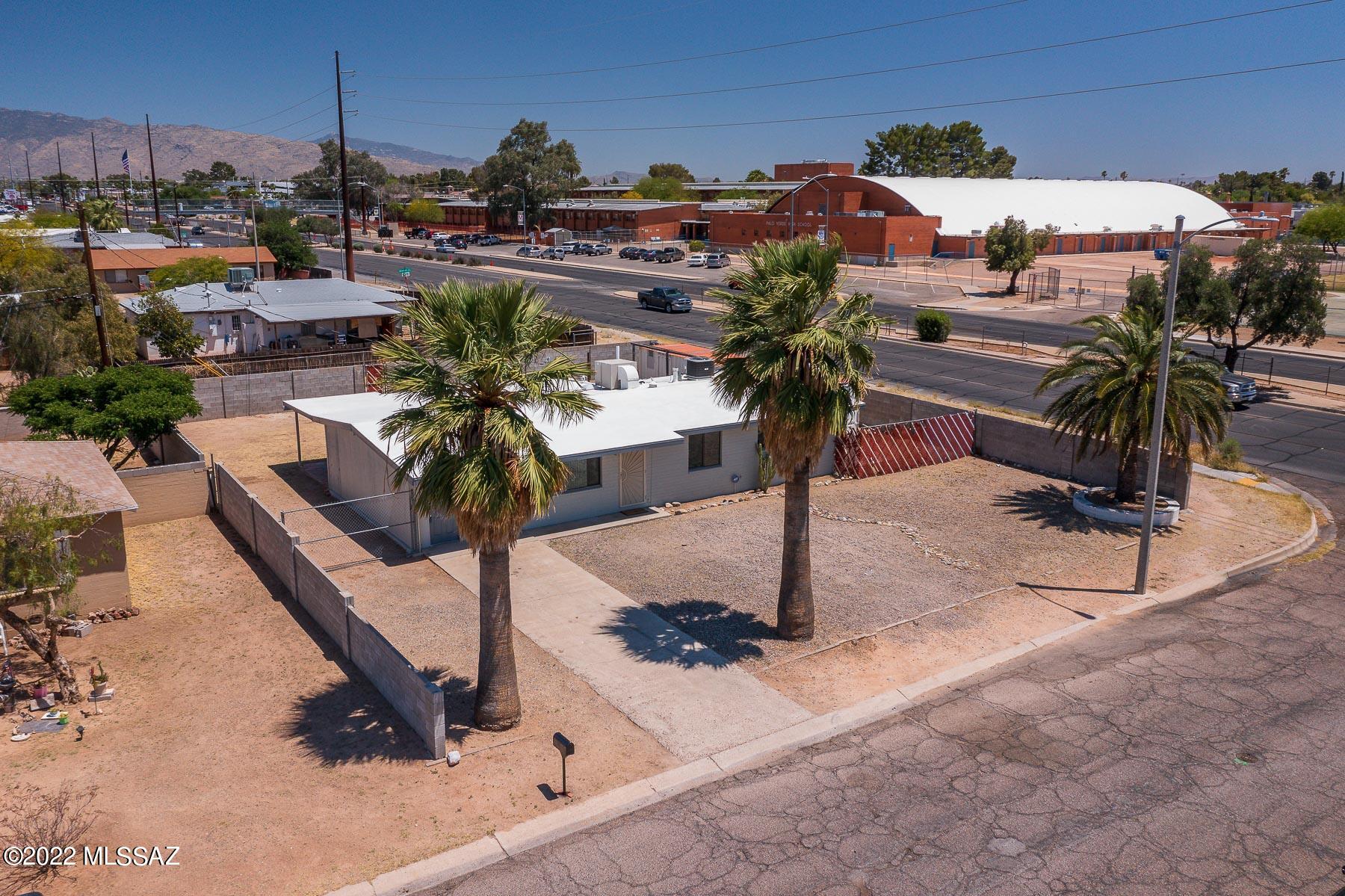 This 3 bedroom, 1.5 bathroom home across from Palo Verde High School features dual cooling with a new (April 2022) 16-SEER Air Conditioner and a 2021 Swamp Cooler, new kitchen cabinets and counter tops, a new water heater, fresh paint, new carpet in bedrooms, tile throughout the rest of the home was Zerorezed, bathtub and surround was reglazed May 2022.  Dual pane windows throughout.  Arizona room that leads to laundry room, and a covered back porch.  Refrigerator in laundry room conveys.  There is a work shop attached to the house, great for storage or a project room.  Shipping container on southside of house may or may not convey. Seller will review all offers on 16 May.  Seller reserves the right to accept an offer prior to then.