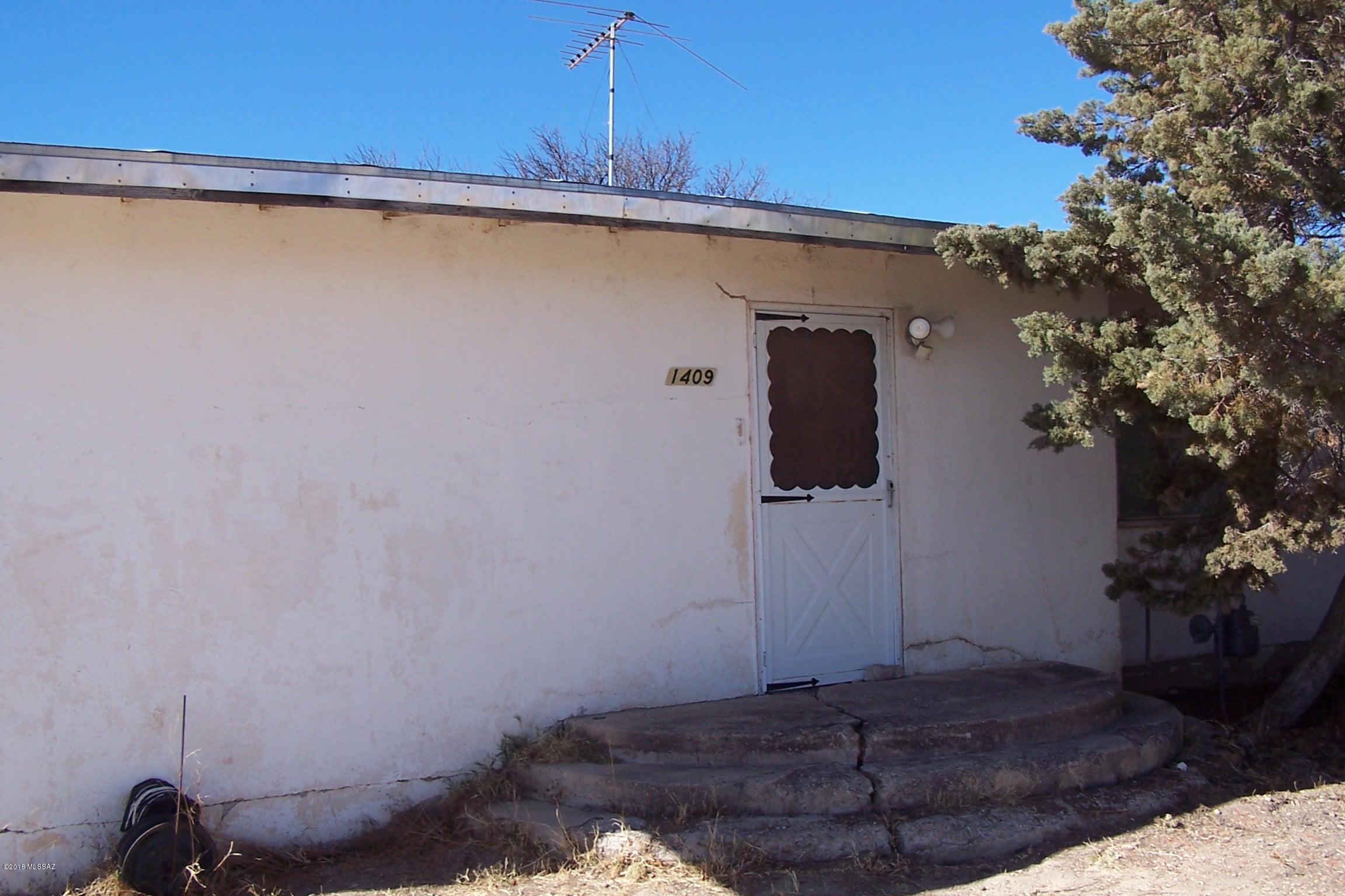 This home and property has a lot of potential, with some fixing up the hard wood floors can be beautiful again.  Nice size property with mature trees on paved road.