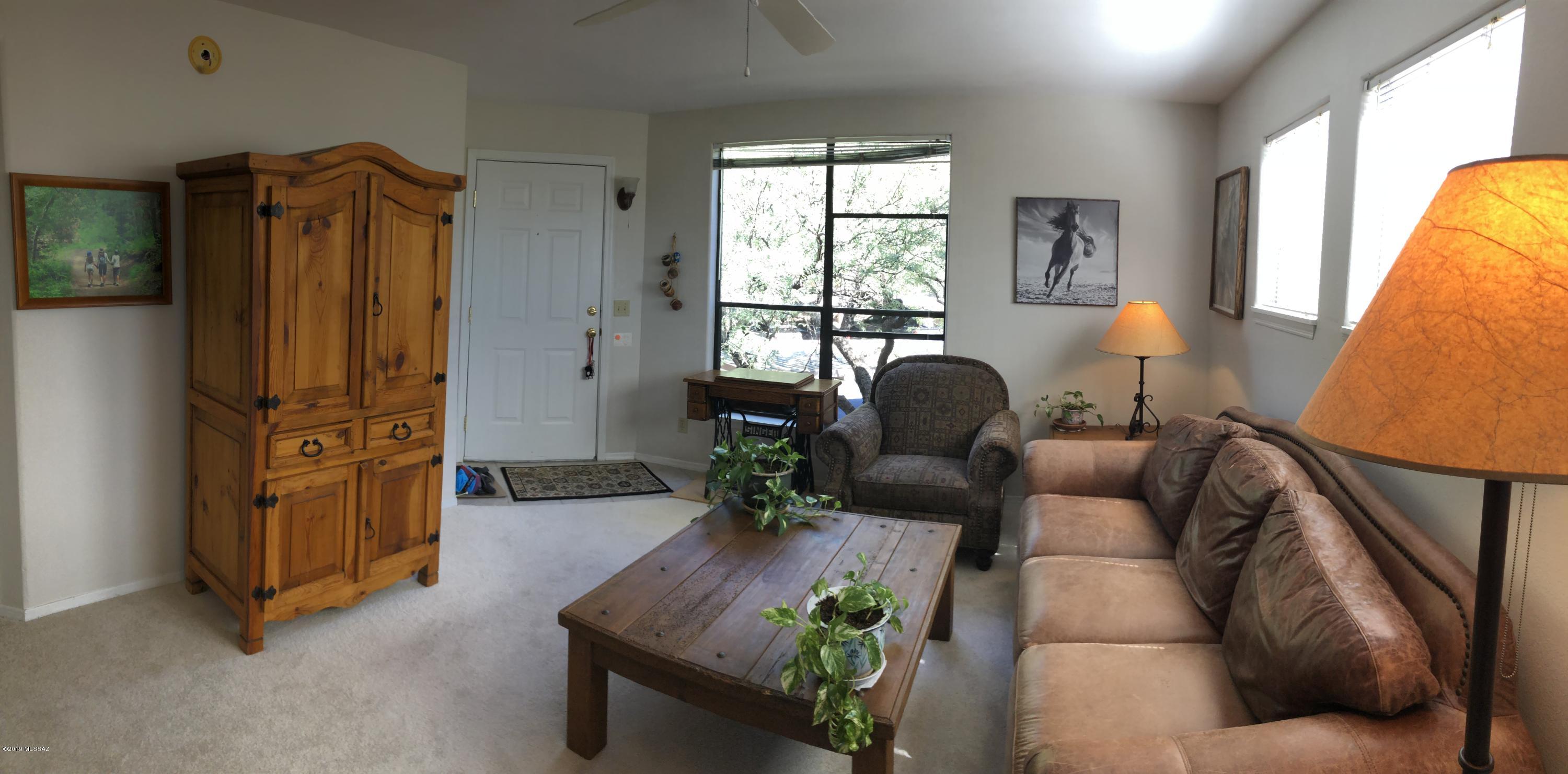Hard to find second floor unit in desirable Canyon View at Ventana Condominium.   The open floorplan includes a kitchen that opens into the dining area and living room , bedroom with spacious walk-in closet, bathroom with two sinks, shower and tub,covered patio, and a laundry closet.  Features include, wood burning fire place, new carpet , ceramic tile, and ceiling fans. Experience a leisure lifestyle with HOA maintained, mature, manicured landscaping with a variety of cactus, trees and beautiful flowers, two club houses, two resort-style pools + spa, weight room, treadmills, gym, and tennis court. The community provides private access to Ventana Canyon trailhead with endless hiking. All this and the convenience of being close to shopping, dining, Ventana Canyon Golf Resort, Sabino Canyon.