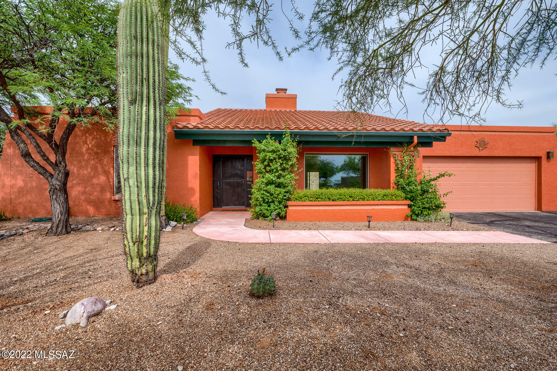 STUNNING CENTRAL FOOTHILLS location with many features for you and your family to enjoy. Large double-sided fireplace with awesome pit seating in the great room. Granite countertops, custom cherry cabinets, newer appliances. Primary bath has a large walk-in shower with built-in linen cabinets.  All 4 bedrooms have large walk-in closets. Beautiful PebbleTec Pool and Spa, putting green, large covered patio, mountain views, very private, and beautifully landscaped. Other features include newer dual pane windows, newer roof (2019), solar/tankless hot water, on-demand at primary sink, newer HVAC (2015), whole house water conditioner, and garage storage cabinets.