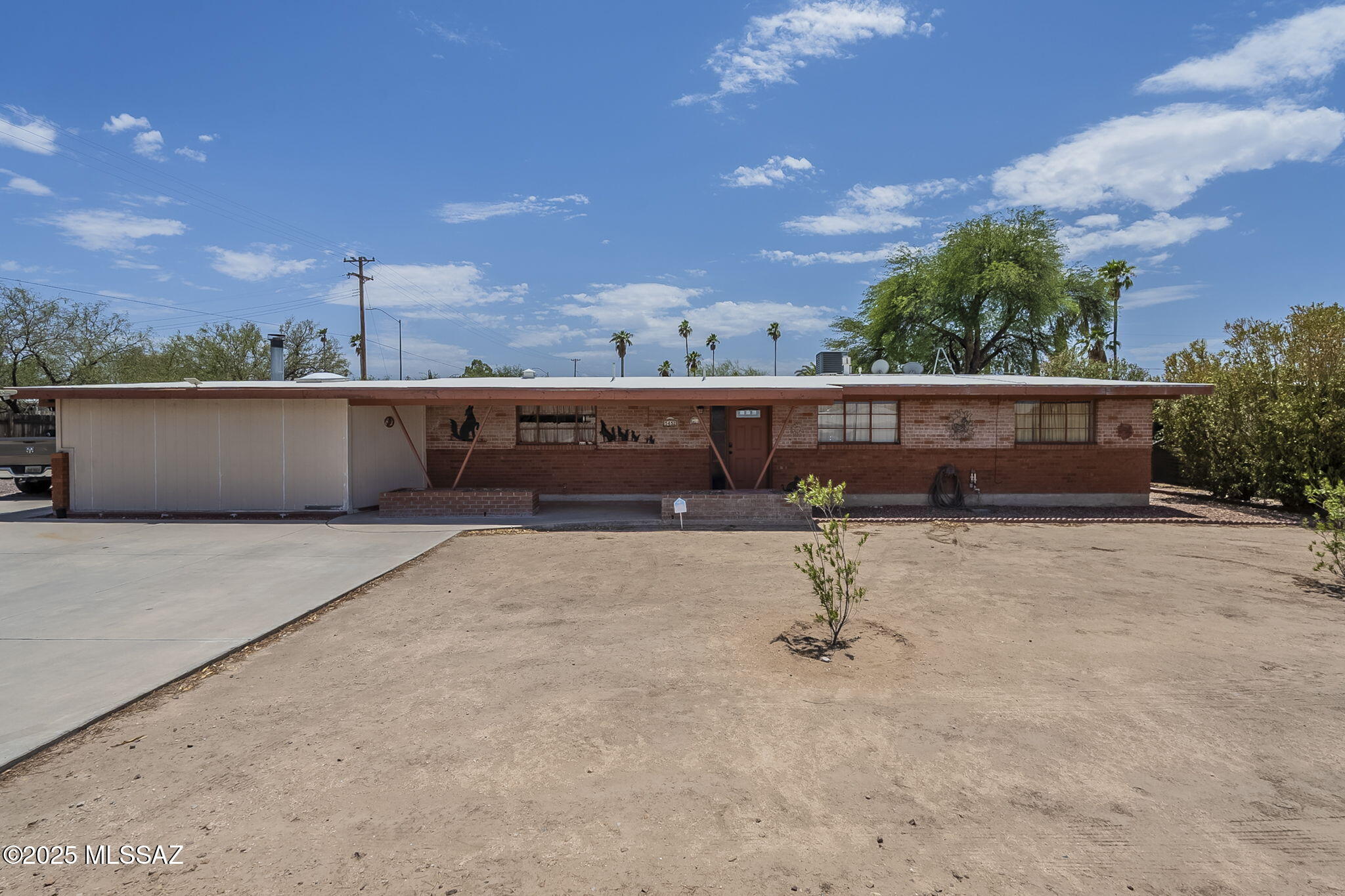 SOLAR TO BE PAID OFF AT CLOSING WITH APPROVED OFFER ($57k balance). 
CENTRALLY-LOCATED, and tastefully UPDATED, this 4-bedroom masterpiece sits on a third-of-an-acre plot that feels like it's in a world of its own. Although you are within a stone's throw of everything Tucson has to offer, the sprawling backyard holds an inviting pool that is only garnished with a waterfall. The private outdoor space is well-groomed and easy-to-maintain, making it ever-ready for those impromptu pools parties and year-round gatherings. As you make your way inside you're greeted with a very well-done array of upgrades that include remodeled bathrooms, granite countertops, upgraded fixtures throughout the home. This addition holds an open space that can be used in array of ways, as well as a tucked away laundry room and guest bedroom. The REAL livable square footage clocks in around 2500 sq ft!!!