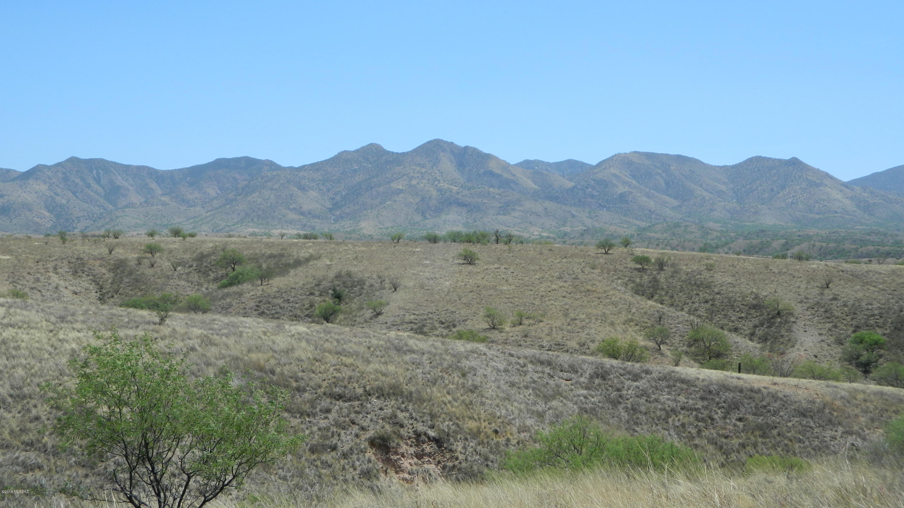 GORGEOUS MOUNTAIN AND CITY LIGHTS VIEW WITH WELL ALREADY DRILLED! Probably one of the nicest lots at Lake Patagonia.  End of the paved road privacy with a great building site on a knoll with panoramic views. Beautiful sunsets and twinkling lights from Nogales in the distance. Electricity and phone right at the lot line, staked and flagged and ready for your Dream Home. Nice neighbors, gentle deed restrictions and only $20 annually for HOA dues.  Enjoy all the recreational opportunities available at nearby Patagonia Lake State Park and easy access to Nogales, Patagonia and Tucson.  Located between Nogales & Patagonia in an unincorporated area of the County.  Usually marketed with Patagonia address, but legal address is Nogales.