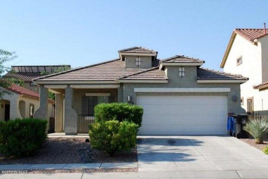 Immaculate home.... This home is a 3bd/2ba home with many amenities In Rancho Sahuarita. Open living area and Large kitchen prefect for entertaining. Kitchen has lots of counter and cabinet space with an island. This home features tile/wood flooring throughout with carpet in a few bedrooms. This community features several amenities and is close to pools, parks, lakes, Walking trails, and so much more. Don't miss this opportunity to view this well-maintained home and making this home yours!