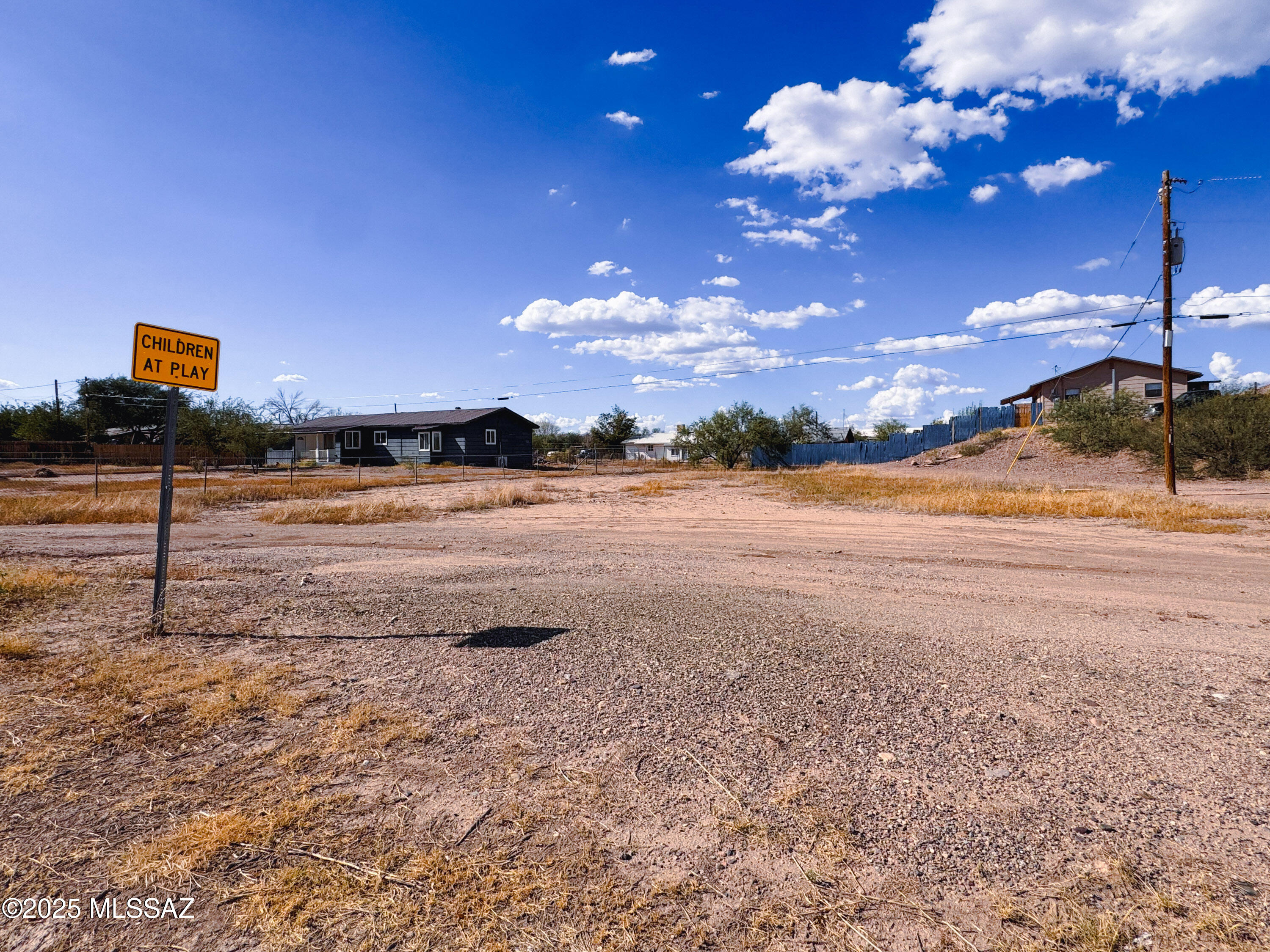 Easy build .26-acre infill lot on E Mark St in the heart of Benson. Close to schools, shopping, and quick I-10 access. Level site with city utilities at/near the lot line (water, sewer, natural gas) and power available via SSVEC.   Ideal for a low-maintenance primary home or downsize build.  Bring your plans and enjoy small-town living with big-sky views, outdoor recreation nearby, and an easy commute to Sierra Vista or Tucson.