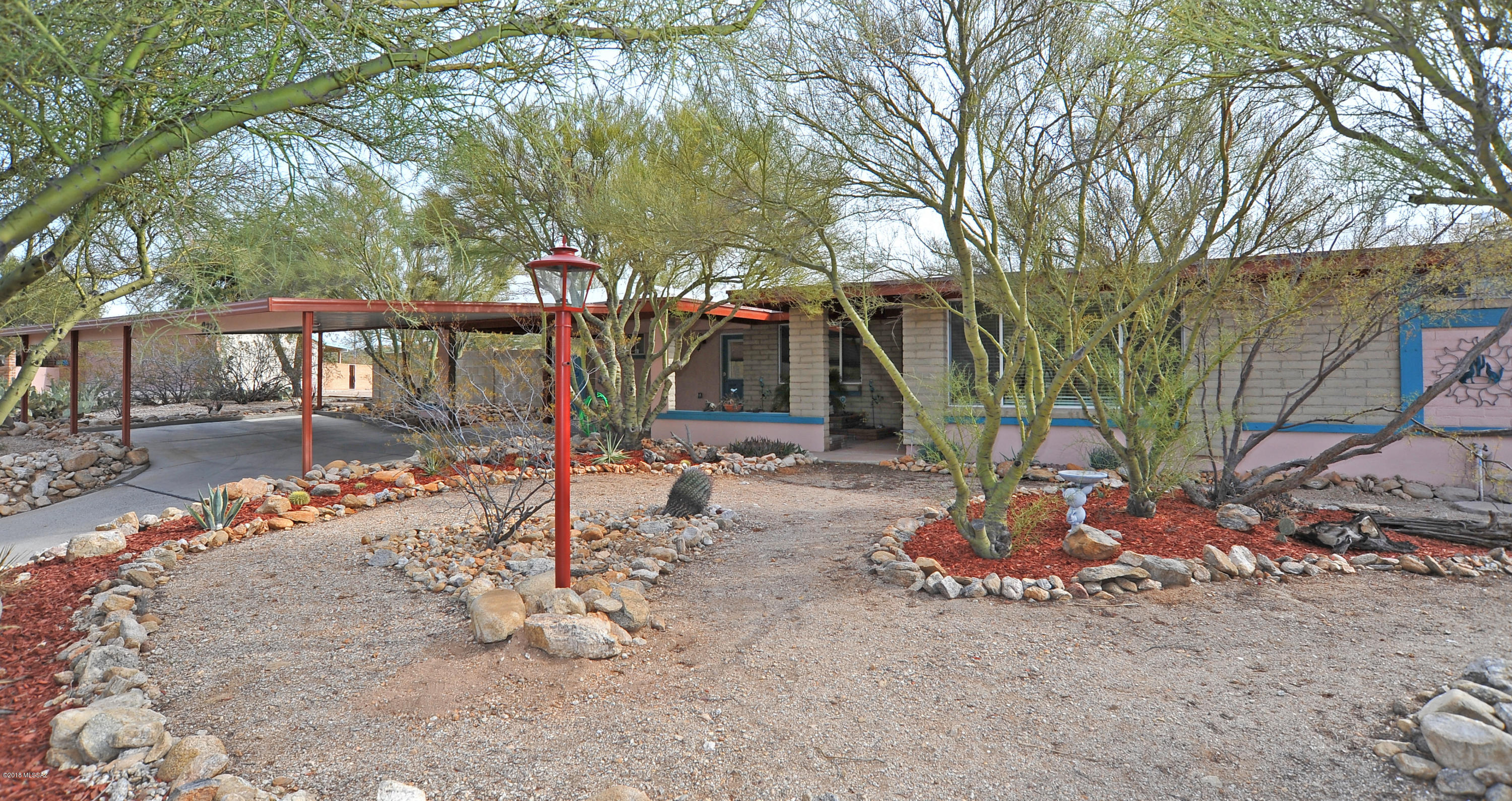 Totally renovated gorgeous property in the Tanque Verde valley and sought after Tres Lomas community with no HOA on nearly an acre with stunning mountain views from all angles and a sparkling PebbleTec pool to enjoy your summers.  Original owners meticulously cared for and updated this masterpiece with licensed contractors, it is not a flip! Opened up living spaces, porcelain ceramic tile throughout, no steps at all, brand new granite counters, cabinets, backsplash and stainless appliances, fresh paint and beautiful natural stone to frame the fireplace.  All plans available to new owners.  This house is move in ready and a perfect place to call home!