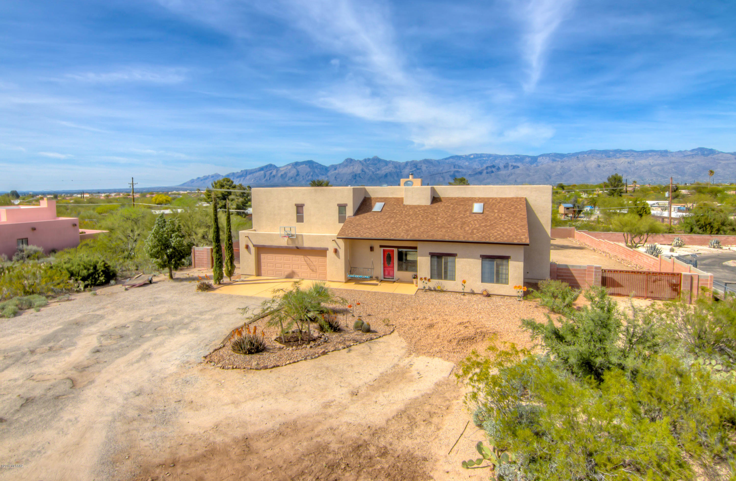 Beautiful, east side, Santa Fe style home on  an acre!  Enjoy mountain views from your private Master bedroom balcony!  Sparkling, fully fenced pool for the upcoming summer months!  4 bedrooms, 3 baths, formal dining area, 2 living areas.  Beautiful fireplace, updated kitchen and baths and new carpet.  NO HOA! Tons of privacy, close proximity to shopping and a beautiful park next door. Plenty of storage, designer touches everywhere, this home is amazing!