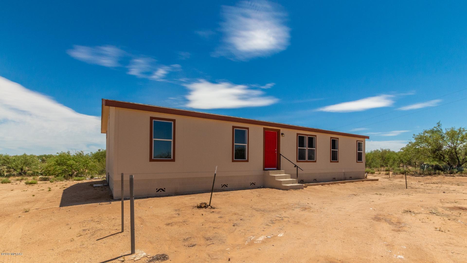 Seller will accept/counter offers from 104,900 to 109,900. Step inside this magnificent newly remodeled manufactured home available on an acre of gorgeous property. Love life while enjoying the serenity of wide open spaces and breathtaking mountain views! Enter into your spacious great room perfect for entertaining! The cool color scheme of the home will magnify your belongs from the start! Spacious living area features beautiful wood style flooring. Create a meal the family will love in your newly updated kitchen!  Retreat after a long day to your master bedroom and private bath! Appreciate two additional bedrooms perfect for guests or an office! Enjoy your backyard overlooking your own personal desert oasis!