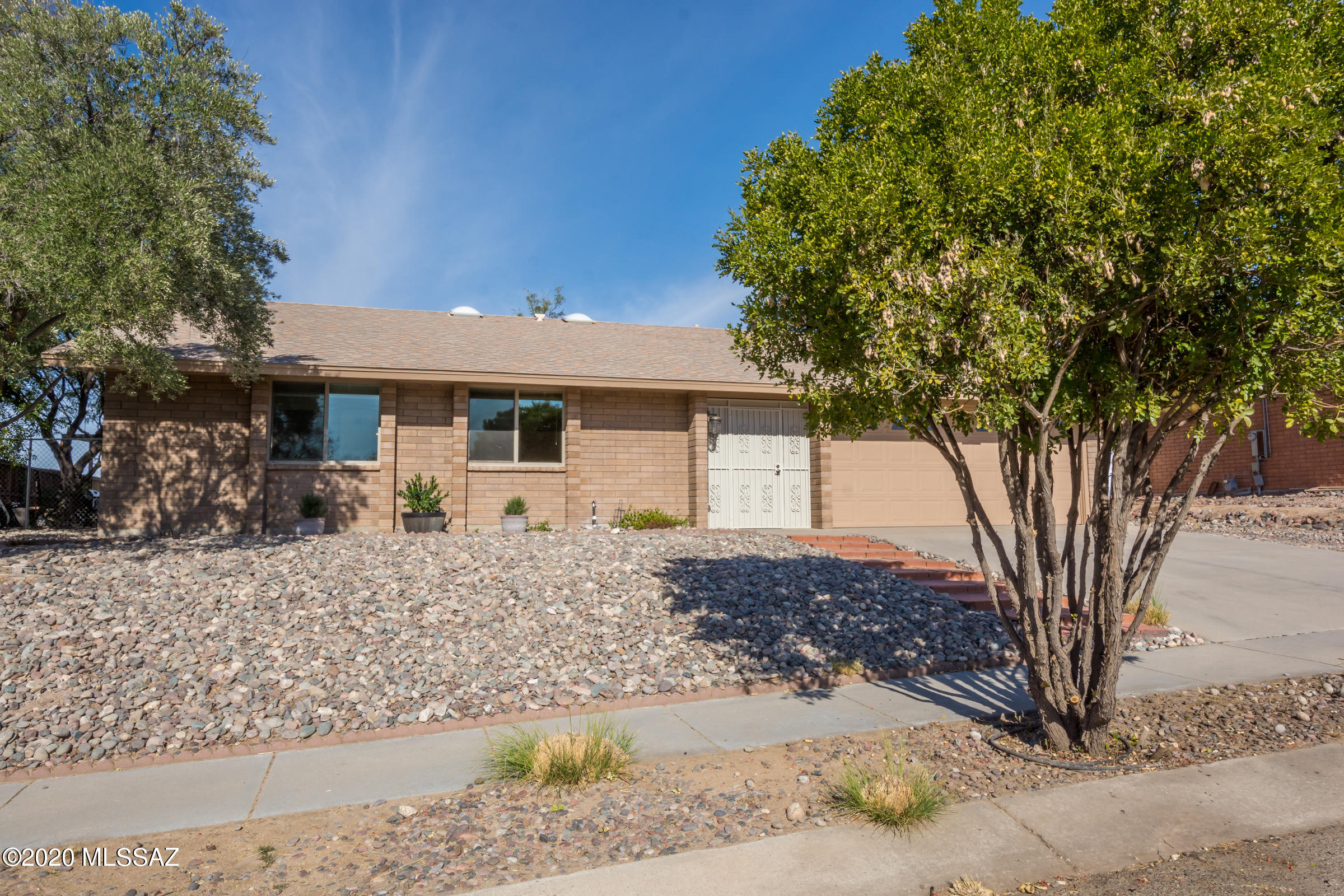 Lots of great reasons to buy this house! Original owner, brand new HVAC system, Dec 2020, newer roof, updated kitchen w/granite counter tops, stainless appliances, new carpet in all bedrooms,exterior painted Oct 2020, No popcorn ceilings, ALL newer windows, washer & dryer,(sold ''AS-IS'') & refrigerator included! New tile floor in master bath & new toilets in both baths. Modern ceiling fans in kitchen area & living room. 2 garage,rare in this neighborhood,f & a 54'' Samsung TV w/remote is included for the new owner! Lots of natural light w/big picture window in main living area & French doors in the dining area off the kitchen that look out to the fully enclosed backyard. New chain link fencing along the backside. Large lot! Close proximity to I-10, the LOOP and Richardson Park!