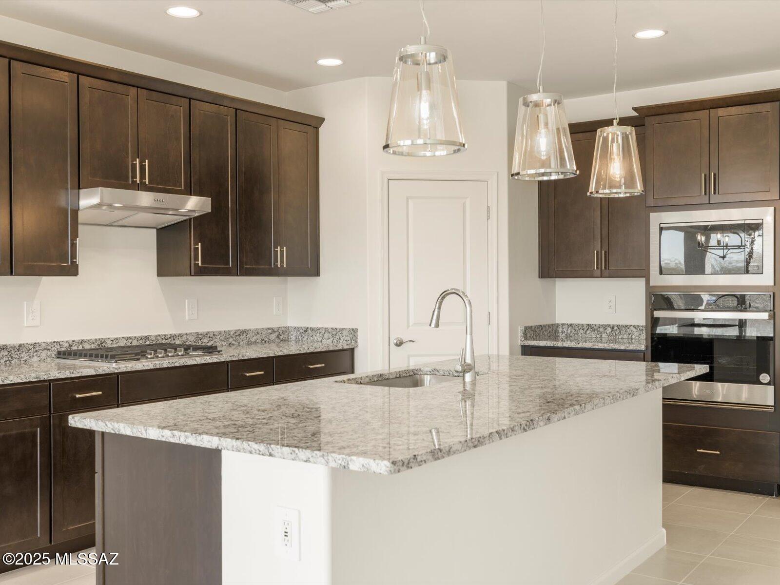 Welcome to this beautifully designed 3-bedroom, 2-bath home featuring an open-concept living area—ideal for hosting guests or relaxing with family. The kitchen island doubles as a casual dining spot or buffet for entertaining, while the spacious primary suite offers a serene retreat with dual sinks and a generous walk-in closet to simplify your mornings.

Additional garage storage is perfect for keeping outdoor gear organized. Located in a gated community at the northeast corner of Broadway Blvd and Houghton, this home offers both privacy and convenience. Just 11 miles north of I-10, Houghton Reserve provides easy access to major employment hubs, shopping, and dining.

Move-in ready with included washer, dryer, refrigerator, and whole-home blinds.