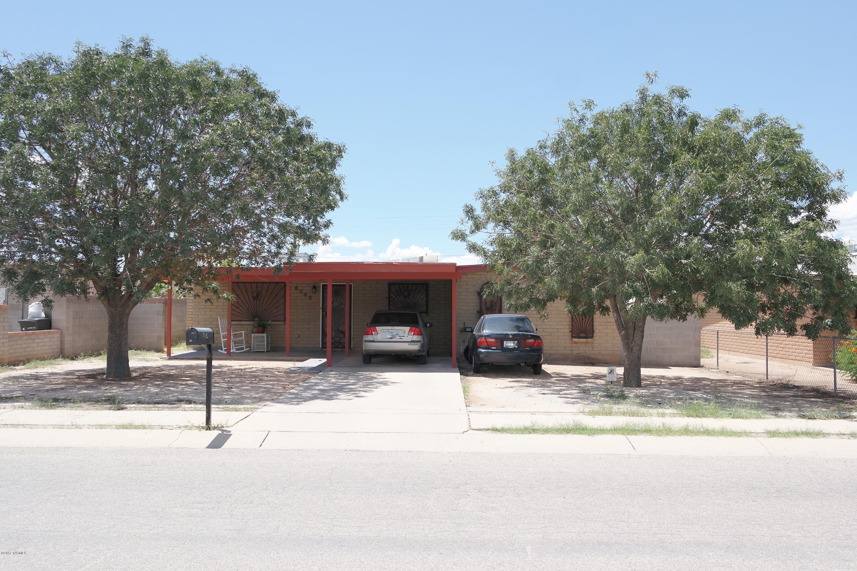 Great location!! Come and see this beautiful 4 bedroom 2 bath home located near the I-10, Airport, DM Air Force Base, Raytheon, etc. Great lot space with newly installed water heater and finished block wall on the front. Tile floor thru out with spacious family room with wood laminate flooring for all family occasions. Enclosed covered patio at the rear with Iron gate. Well taken care of home awaits for a new owner! Come and see and make this home yours today!!