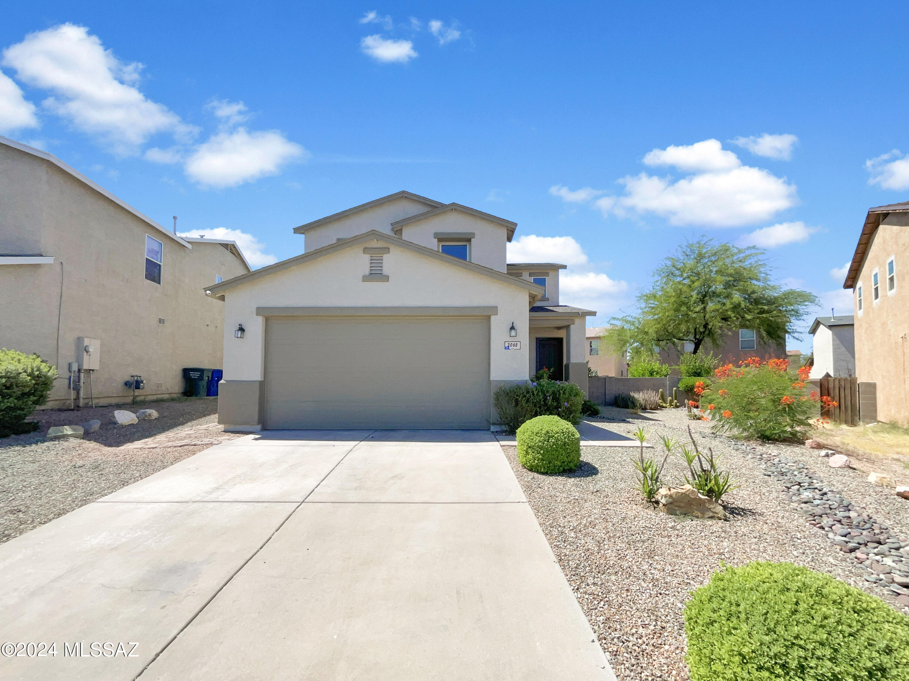 Welcome to this beautifully updated home. The interior boasts a fresh coat of neutral color paint, creating a calming and inviting atmosphere. The kitchen is a chef's delight with a stylish accent backsplash and all stainless steel appliances. The primary bedroom features a spacious walk-in closet for all your storage needs. The primary bathroom features with double sinks. Enjoy the outdoors on the covered patio overlooking the fenced-in backyard, perfect for privacy and peace. The low maintenance landscaping adds to the property's appeal. Recent updates include partial flooring replacement and fresh interior paint. This home is a must-see and is sure to impress.