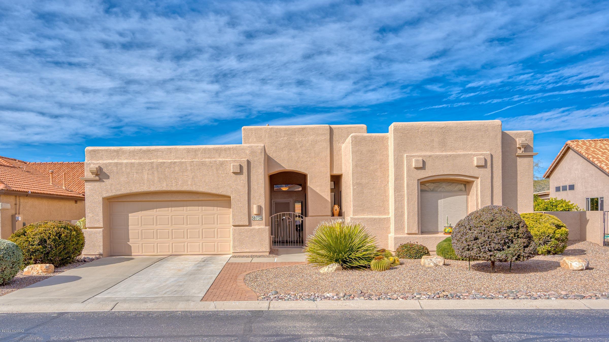 Expansive golf course views spread out before you the moment you walk into this great split bedroom Dakota model. This territorial style home is sited on a large golf course lot with plenty of windows designed to take full advantage of the golf course views. Spacious island kitchen features maple cabinetry, plenty of counter space and is open to the nook and family room. Family room has easy access to patio, gas fireplace & plenty of windows. Master suite w/en-suite with double vanities, large soaking tub, separate shower and walk-in closet. Two guest rooms and private bath has ample space and privacy for your guests. Whether enjoying the sunsets, the wildlife passing by, or watching the golfers from the extended ramada, this home has it all. Come enjoy the best of SaddleBrooke.