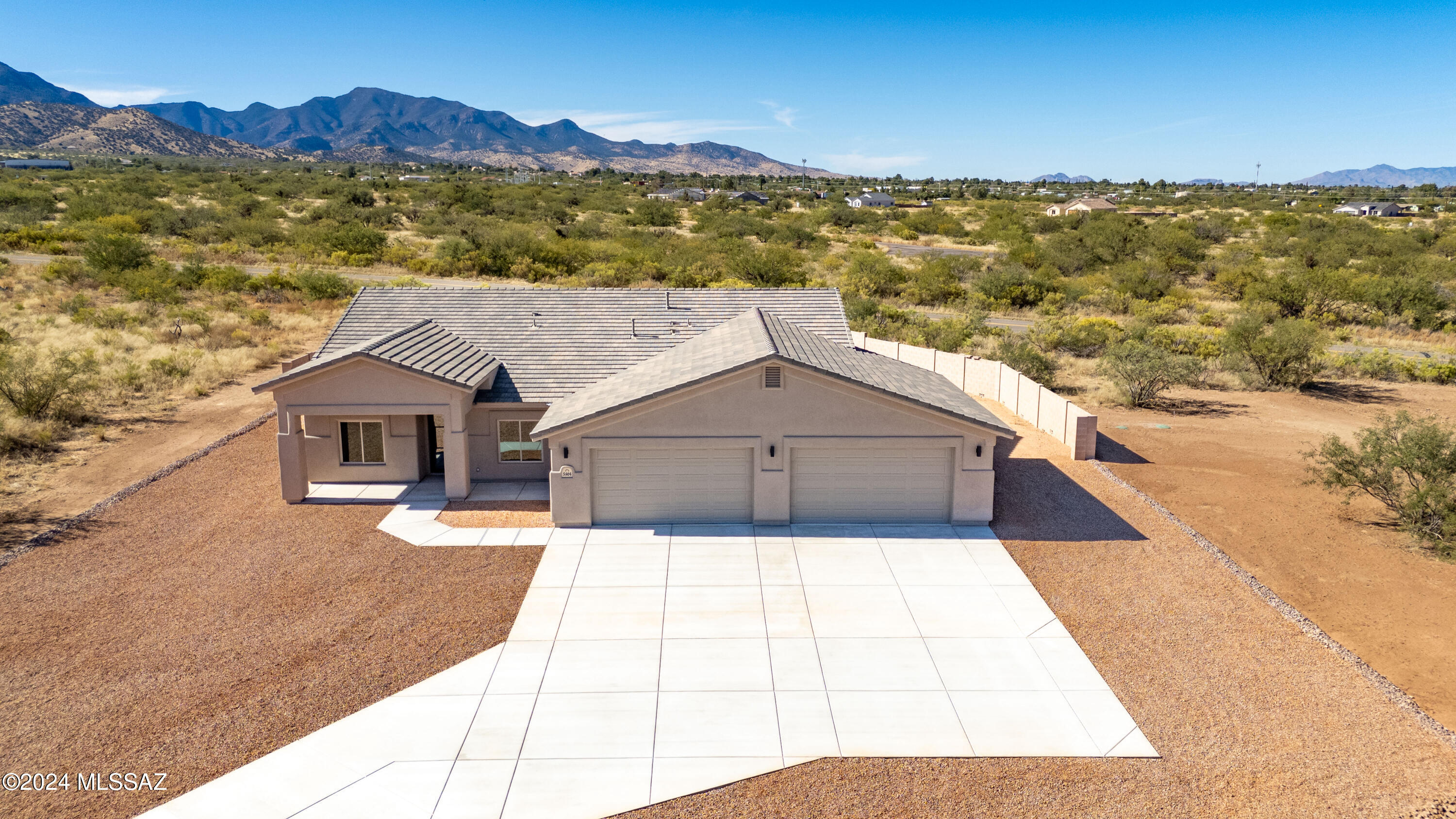 New Construction; Move-In Ready Sun Canyon Home. This is a great opportunity to move into a custom new home without the wait time. If you need garage
space, this home offers a 4-car extended & insulated garage complete with epoxy floor finish. Enjoy mountain views on the 10'x60' covered patio or sit on the
porch and enjoy the sunrise. The home is located in a cul-de-sac and is complete with a concrete driveway to the street. Their is room to add a future pool, shop,
casita whatever you need. Some of the Construction features; 2x6 exterior framing, Polyglass premium roof underlayment, R-21 Open-cell foam-exterior walls,
Tyvek wrap vapor barrier. This is a must see home with granite counter tops & wood-look tile flooring throughout, stainless appliances, large laundry room, 4BR,2BA,4Car