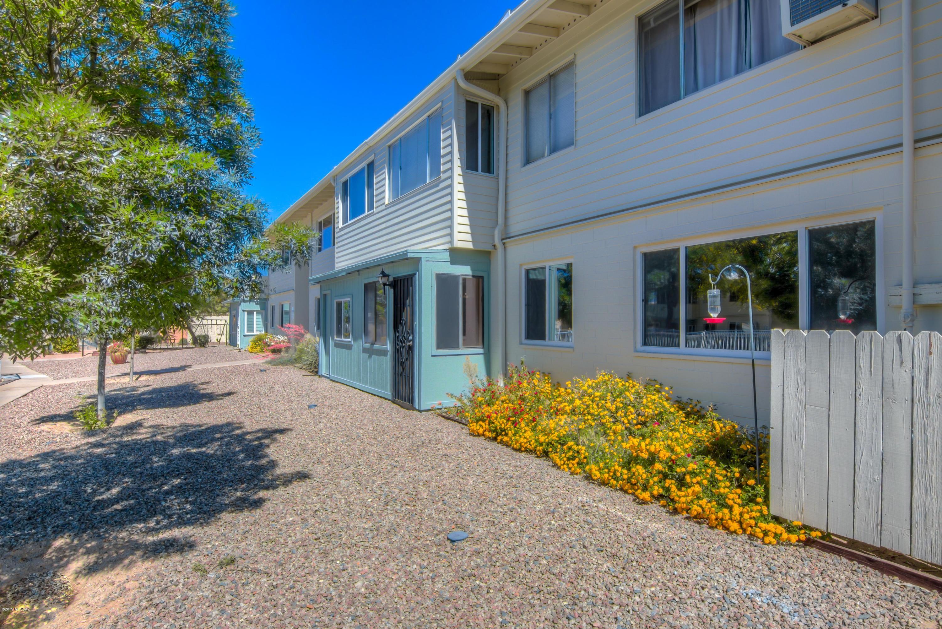 FURNISHED 1 BEDROOM, 1 BATH CO-OP WITH BONUS ROOM (could be second bedroom or office) at a great price! Ground floor location in desirable Echo Ridge II, end unit overlooking sparkling pool and mature, beautiful well maintained landscape. Monthly co-op payment includes property taxes, building exterior maintenance, trash, sewer, WATER, grounds maintenance, pest control and all common areas.  Ramada, pool and BBQ grills available, and one covered parking space.  This co-op is in a sought-after East side location! CASH BUYERS ONLY and no rentals allowed; owner occupants only. Buyers must meet board approval requirements. Move in ready!