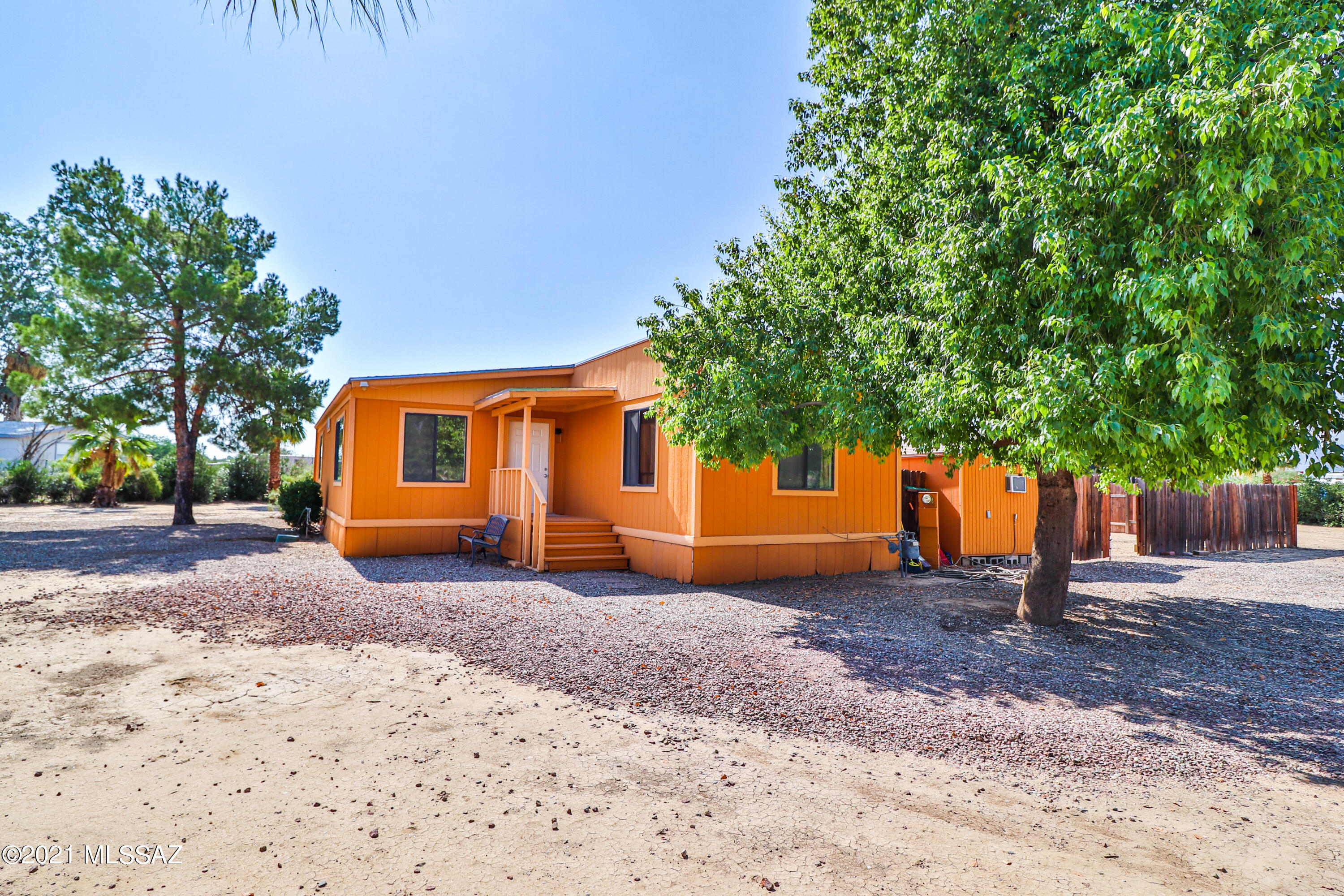Gorgeous upgraded immaculately clean fenced in horse property. Oleanders planted around fence line of property to make it very private. Located on NW side of town by Cortaro and I-10 with all the chain restaurants and shopping across the highway. Beautiful Mountain View's all around. This 2 bed 2 bath double manufactured home has been modernized in all the right places! Kitchen features granite countertops as well as in both bathrooms. Stainless steel appliances and real wood cabinets with a lazy susan, Also new deluxe vinyl wood flooring, new water re-pipe with Apex. The home sits on a spacious huge lot 1.16 acres with lots of beautiful palm trees. Also RV hook up! Come view it today!!!