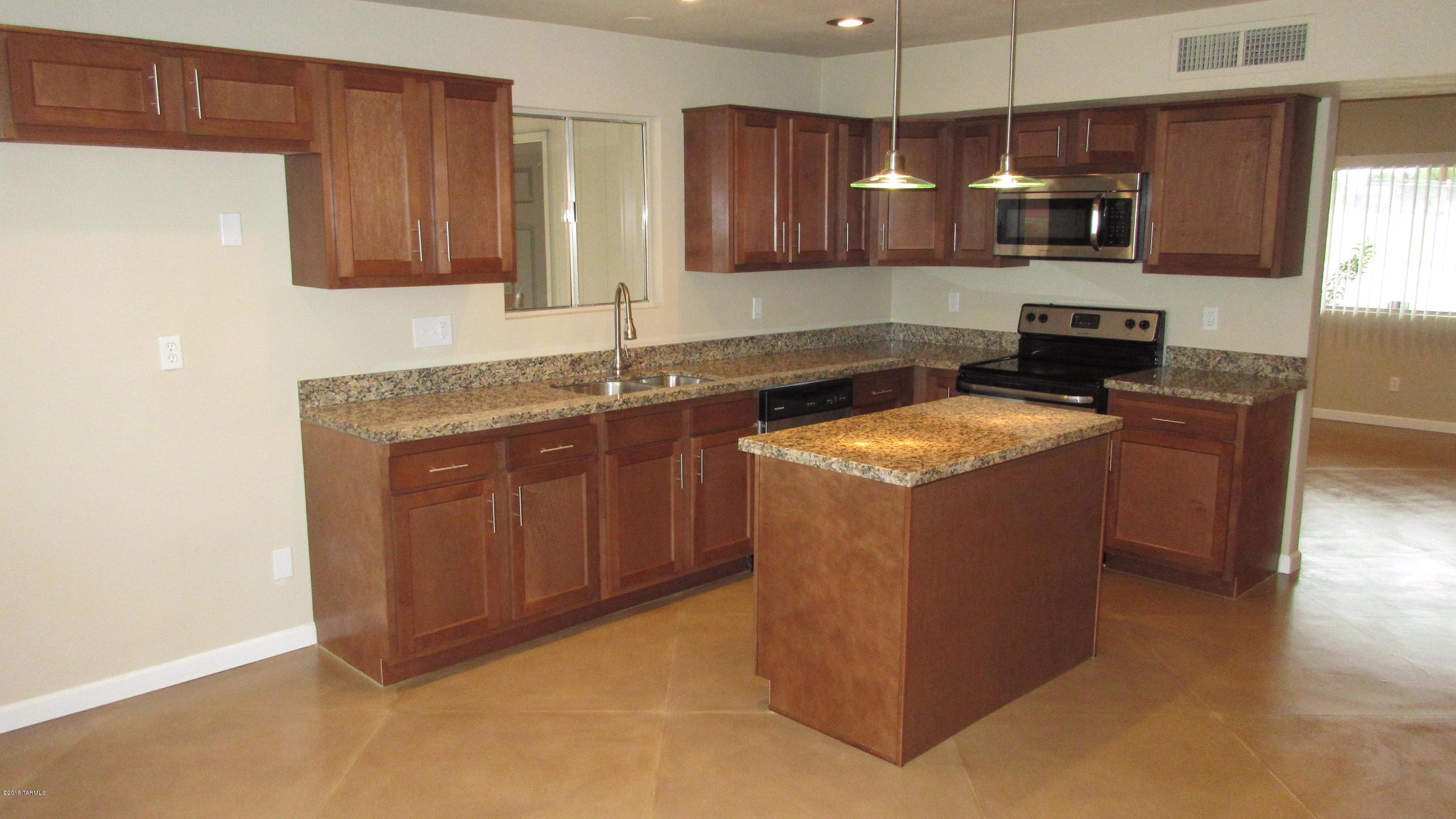 Range priced $160,000- $165,000. Very Cool Horizon Hills home featuring a huge nearly 1/4 acre lot with wonderful Tucson Mountain views. Plenty of space for RV or boat parking with attached workshop/storage and additional storage shed. Inside you will find gorgeous concrete floors, an open kitchen with concrete counter top, pendant lighting, new cabinets and wonderful natural light. This home boast three nice sized bedrooms, remodeled bathrooms, new fixtures and lighting, fresh pain and new carpet in the bedrooms. It would be challenging to find a better buy in the northwest for the money. Make an appointment to see this property today. Close to I-10 and a short commute to downtown and the U of A. Close to restaurants and shopping.