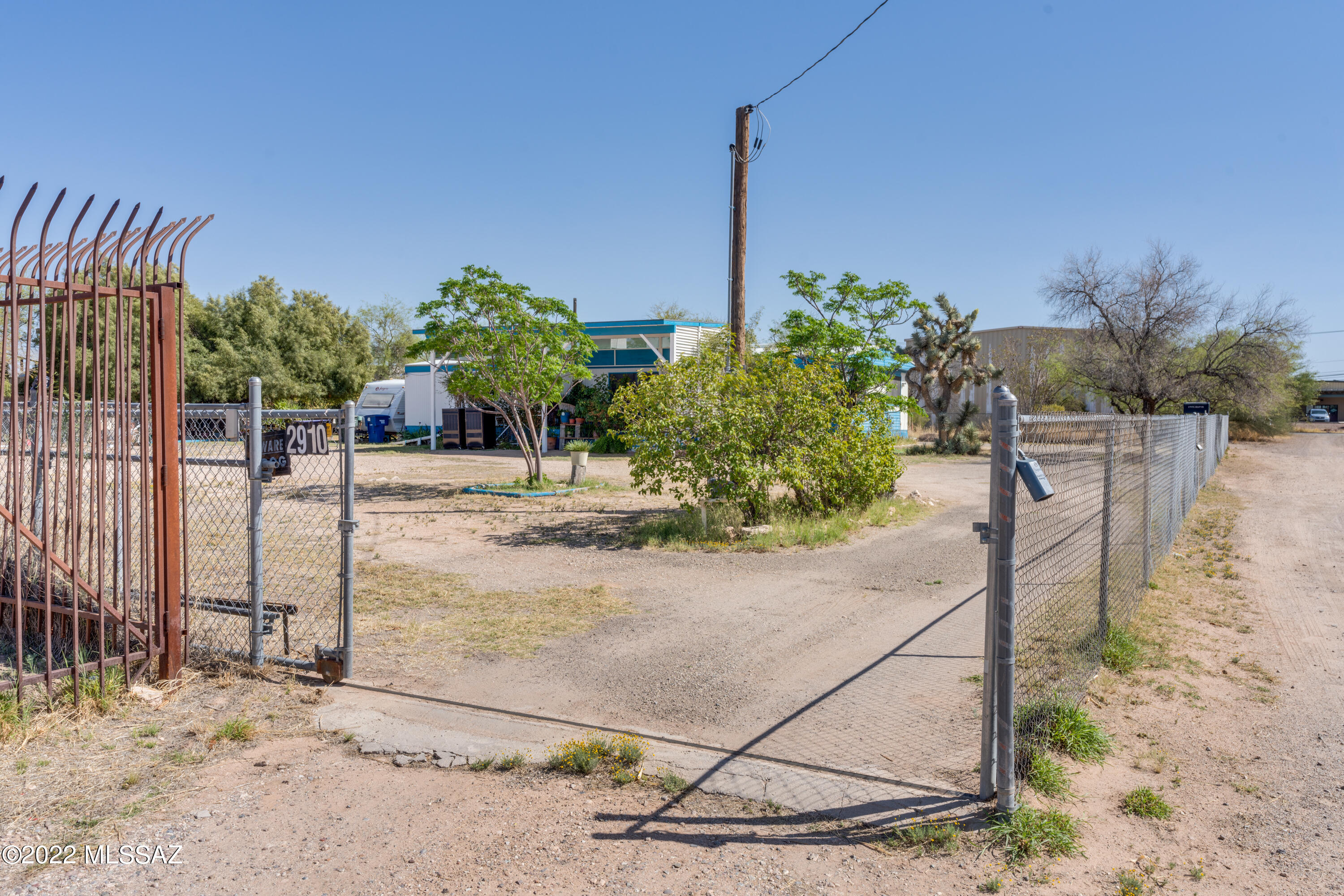 P1 Zoned property on a large fenced in lot, has a 3 bedroom 2 bath manufactured home on it. This would make a great construction storage lot with care taker quarters. Lots of opportunity with this property, close to  I-10 and major access roads. Property is being sold in as-is condition seller will do no repairs.