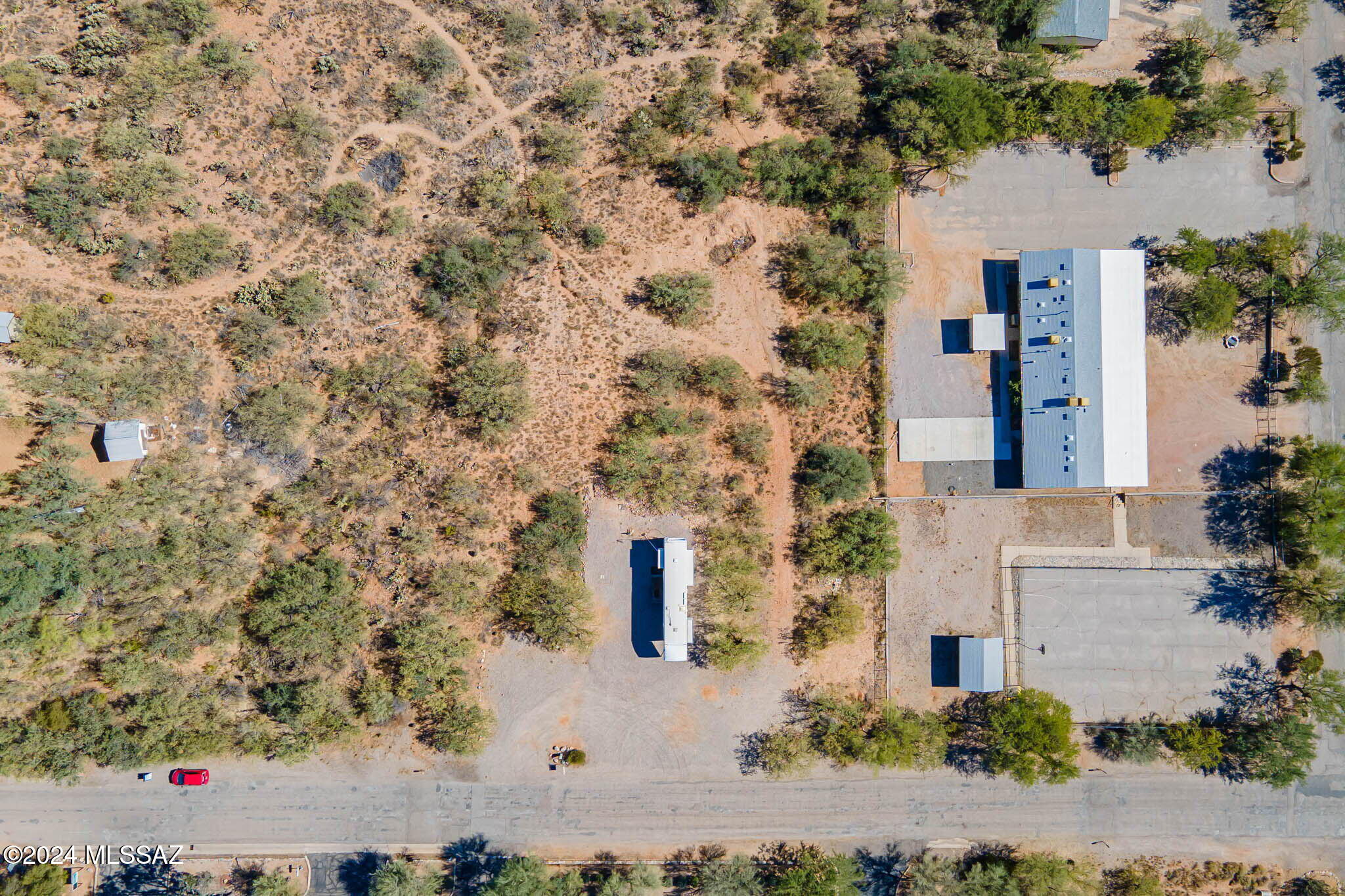 The neighborhood is known as Catalina.  The area is a mix of single family and manufactured homes 8000 square foot to 1 acre parcels. View of Catalina Mountains to the East with a rural atmosphere with convenient access to schools, shopping and recreational amenities. Buyer will need to run water and gas to property.