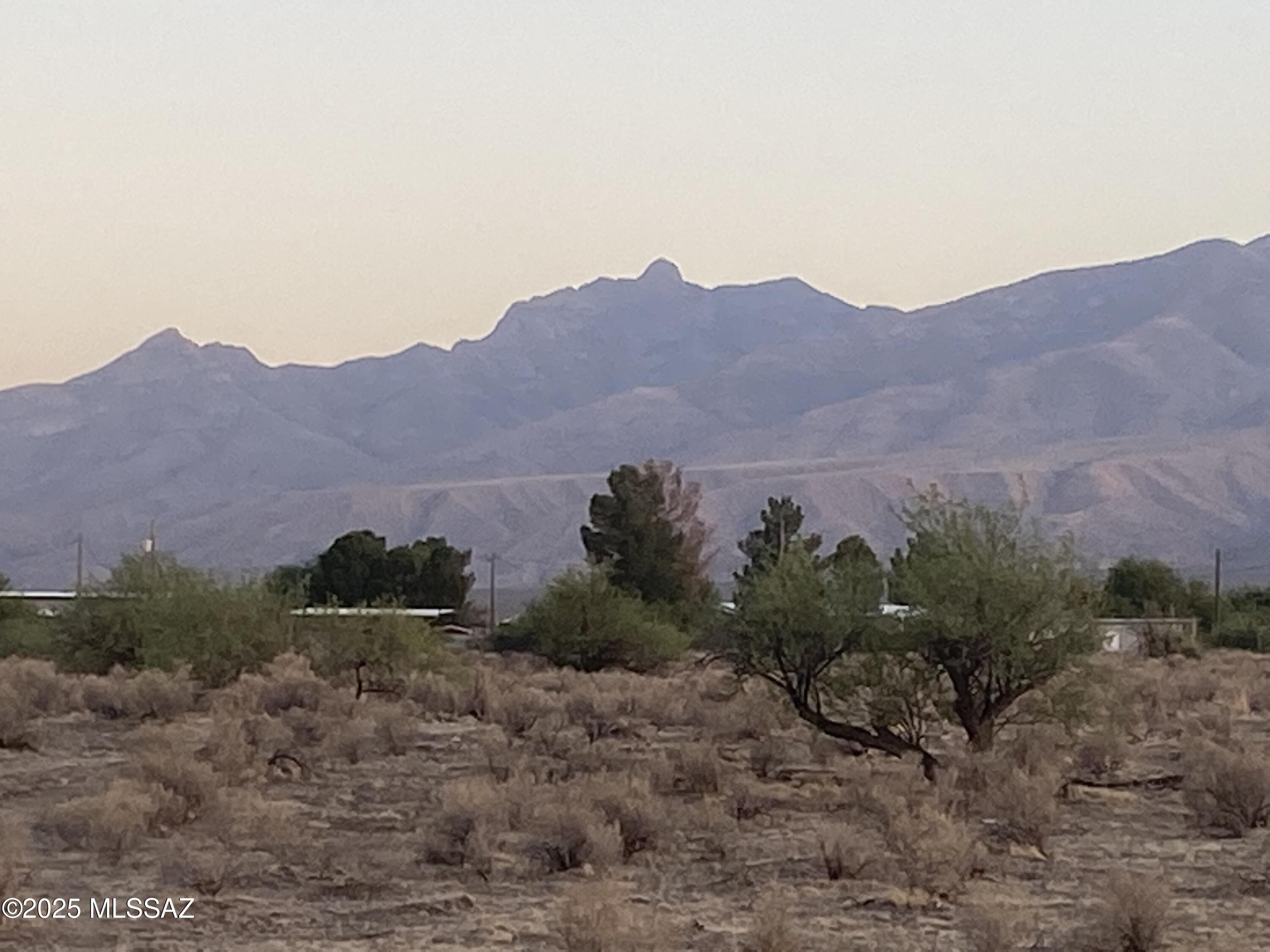 Excellent Location and Priced to Sell, One Acre Building Parcel Located in White Fence Farms Subdivision. Electrical power and city water are nearby.  This Handsome Homestead is nestled in the perfect spot to enjoy spectacular mountain views, quiet sunsets, and the calling of coyotes and quail.  You are minutes from areas where you can fish, hunt, hike, and camp. Meanwhile, ''civilization'' is a short trip back into town.   Interested?  Better call fast. ~ It may not last!