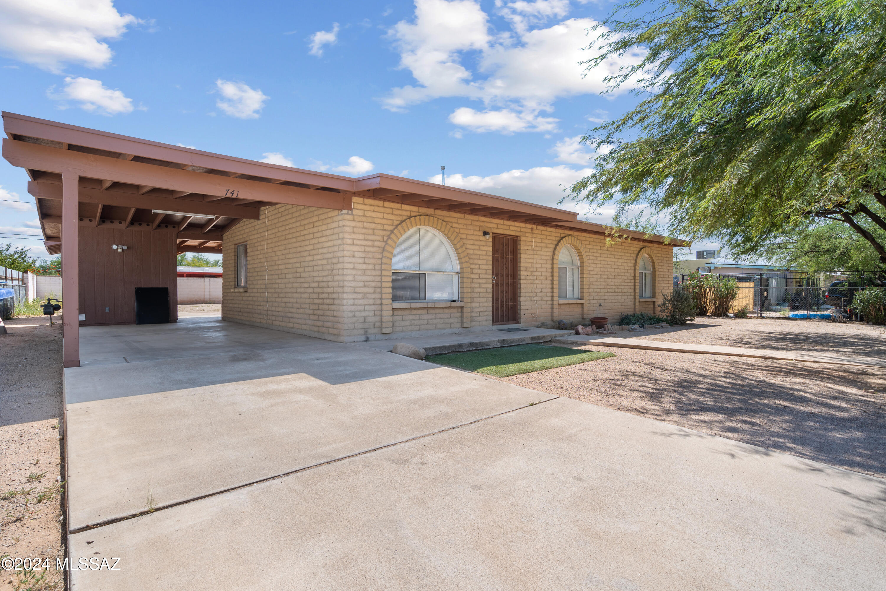 Looking for a great starter home or investment property? This recently renovated 3-bedroom, 2-bath home on Tucson's south side is perfect for first-time homebuyers or investors alike. Zoned R2 on a spacious .23-acre lot, there's plenty of potential to add a second home for rental income or create a multi-generational living space for your family. Inside, you'll find fresh new flooring and paint, making this home move-in ready for you and your loved ones. The sturdy slump block construction ensures long-lasting durability, and outside, the carport provides convenient parking with a large laundry and utility room, plus an extra storage unit for all your extra belongings. This home is ideally located near some of Tucson's fastest-growing areas, with easy access to both I-10 and I-19. You'll be just minutes from popular restaurants, shopping at the Fashion Park Shopping Center, and all the entertainment Tucson has to offer. Whether you're looking for your first home or a smart investment, this property is ready for you!