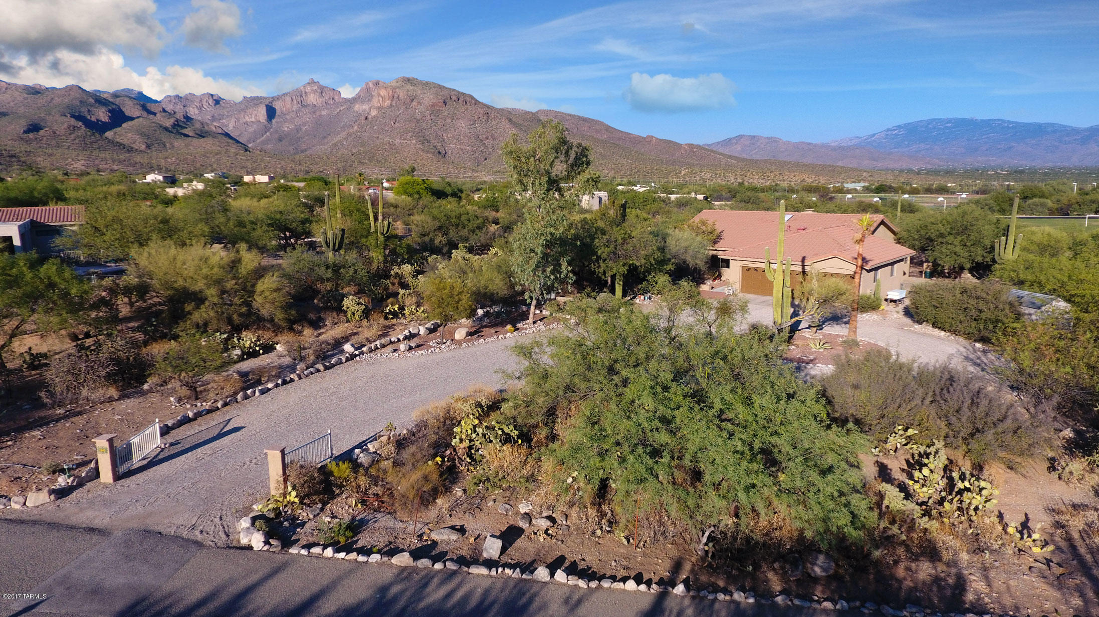 Back on market! Price reduced! Fantastic location! Charming and updated custom home on an amazing 1.7 acre lot offering privacy and mountain views. Walking distance to the Coronado National Forest, Sabino Canyon Recreation Area and District 16 Schools! Spacious open floorplan w/ high ceilings. Family room w/ vaulted ceilings and cozy fireplace. Spacious island kitchen w/ beautiful granite counter tops and newer SS appliances. Private master suite with walk-in closet and large master bathroom. Tile and wood laminate flooring. Freshly painted (2017) inside and out. Over-sized 3 car garage.  Tile roof. East facing rear yard offers privacy, views and shade from afternoon sun. Floor plan in virtual tour link (photo tab). No HOA! One of the best locations in Tucson! Must walk east of rear yard wall to see how large this lot is, the wonderful desert vegetation and the beautiful views.

Gecko Pest Management Warranty for subterranean termites good through 3/11/2020. See attached.

Last buyers loss is your clients gain!