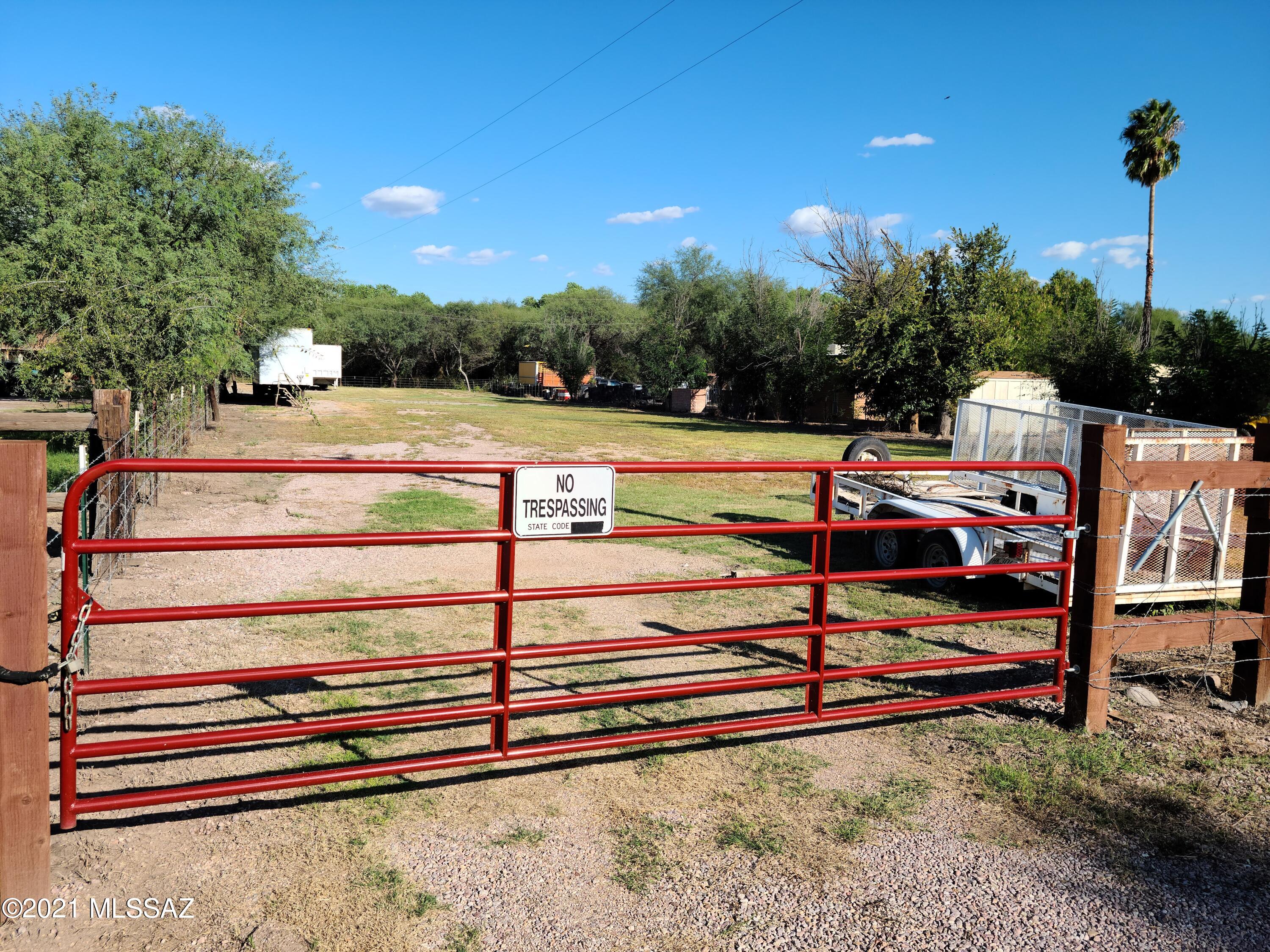 Commercial vacant lot, easy access. Owner has brought in 50 truck loads of rock, and AB mix to level and raise the lot above monsoon rain runoff and recently had new fencing, and a gate installed. See photos of raised parcel. A unique opportunity to purchase vacant commercial land in Tumacacori.
