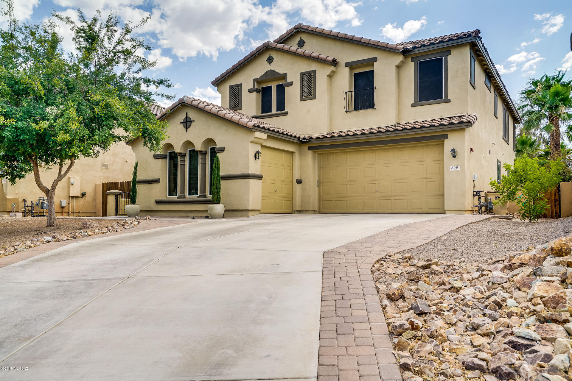 Rancho Sahuarita Home For Sale: This 5 bedroom 3 full bath home is located in Rancho Sahuarita. Open up the beautiful front door, which can double as a screen door, during the cooler seasons to let air flow through the house. Designer concrete throughout the house downstairs & wood flooring throughout the upstairs, with carpet located in the bedrooms. Enjoy cooking in the big newly remodeled kitchen, new stainless steel appliances, lots of space on the new quartz counter tops, & cleanup can be made easy with the giant farmhouse sink. Upgraded features of the home include, UV Sun screens, water softener, & variable speed motor pool pump. Big back yard, great for hosting pool parties, backs to neighborhood park off of Rancho Sahuarita Blvd. Close to shopping center & freeway for the commuter