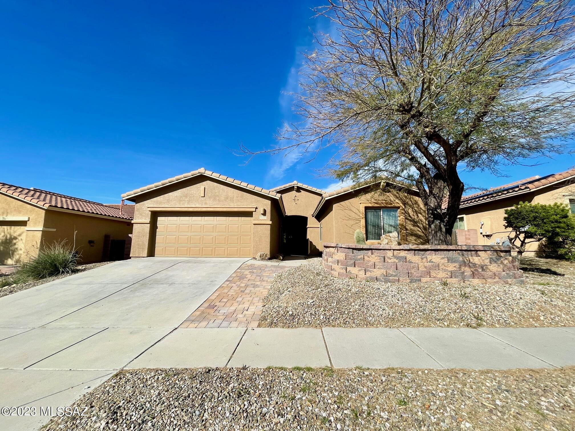 Great Oro Valley location. This 4 bed, 2 bath house features an open concept split bedroom floor plan with tile flooring throughout. Lots of space with a great room, formal dining, kitchen eating area, and breakfast bar area in the kitchen. Stainless frig, gas stove, and dishwasher are included. The primary bedroom is large with access to the patio and has an attached 5-piece bathroom. Awesome large backyard with a covered patio and lots of trees for shade. 3 car tandem garage. Unless otherwise requested by tenant put down to Blue Fox is an Equal Opportunity Housing Provider. We are also licensed Realtors