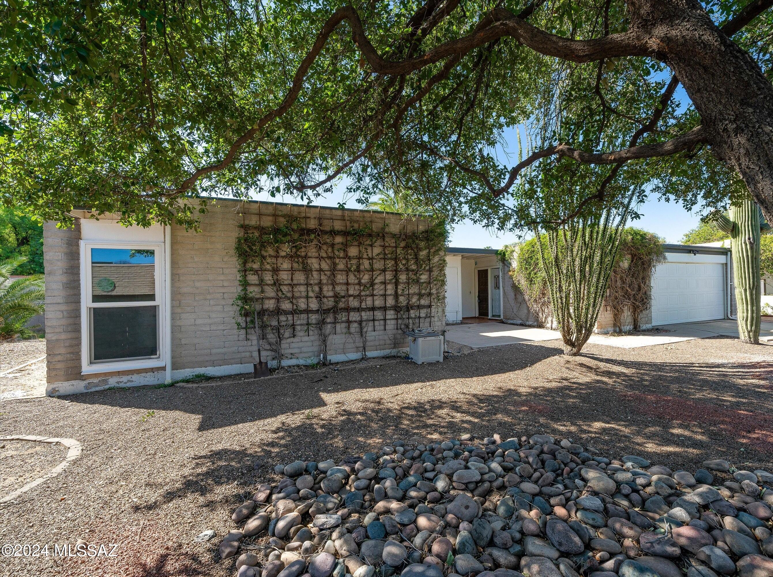 Come take a look at this classic East-side home located in a quiet cul-de-sac. Wonderfully maintained and ready to become your new home, the location of this spacious home is a dream with convenient access to schools, shopping, retail, and restaurants, and more. With an updated kitchen, new carpet, newer roof and A/C, ceramic tile, and even a cactus garden out back, this great home welcomes you with open arms!